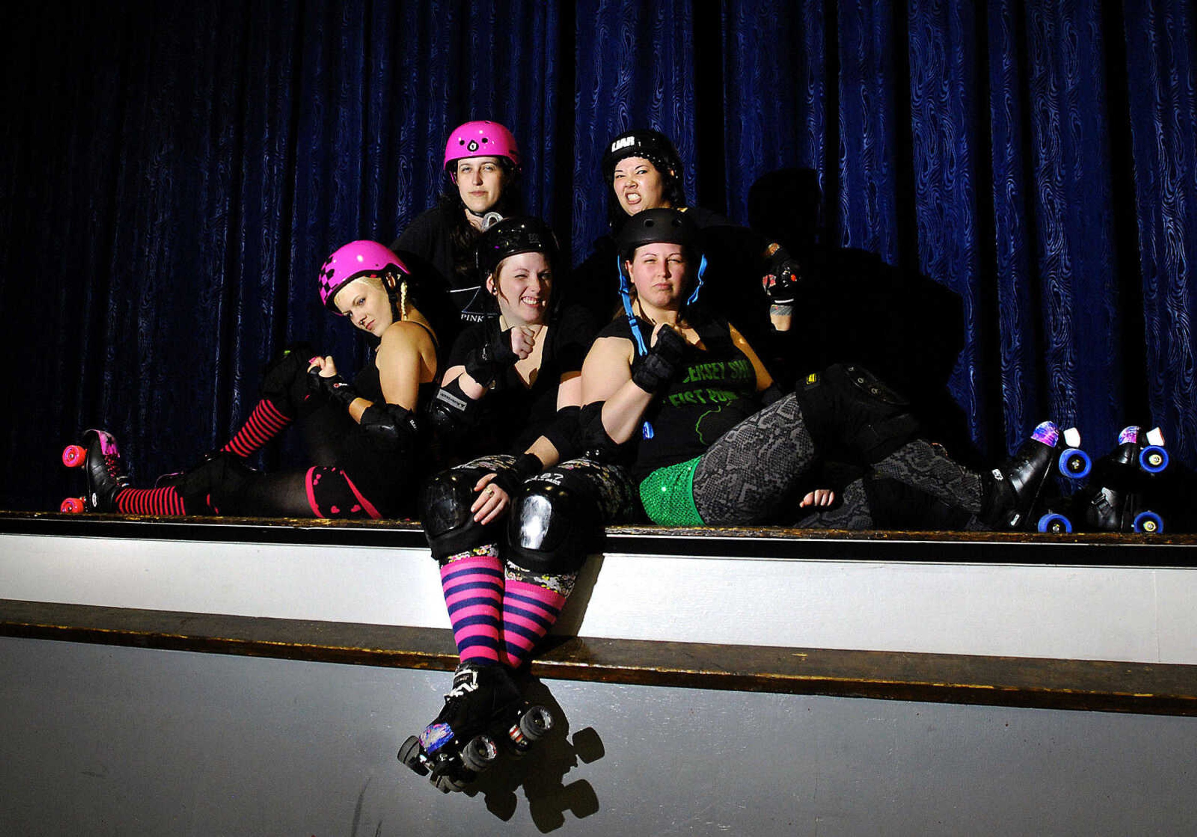 LAURA SIMON~lsimon@semissourian.com
Cape Girardeau Roller Girls clockwise from top left, Katherine "Holly Boo-yah" Webster, Jennifer "Skate 675309" Craig, Jordan "Death on Two Skates" Wilhem, Julie "Bobbie Soxxx" Moser, and Brandi "Billie Lux" Brashear.