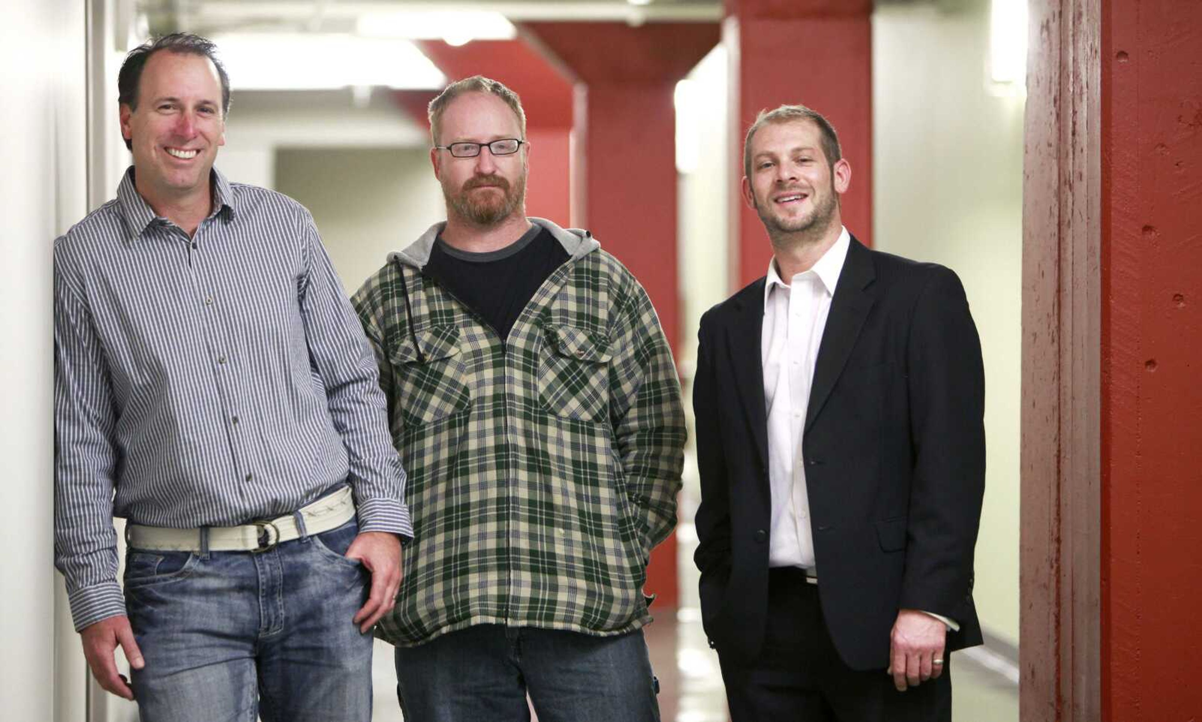 The founders of the new Springfield, Mo.,-based crowdfunding website CrowdIt, from left, Paul Freeman, Markus Pope and Jason Graf pose for a photo March 28. The site, which launches June 4, hopes to compete with the larger and more well know crowdfunding websites Kickstarter and Indiegogo. (Nathan Papes ~ The Springfield News-Leader)