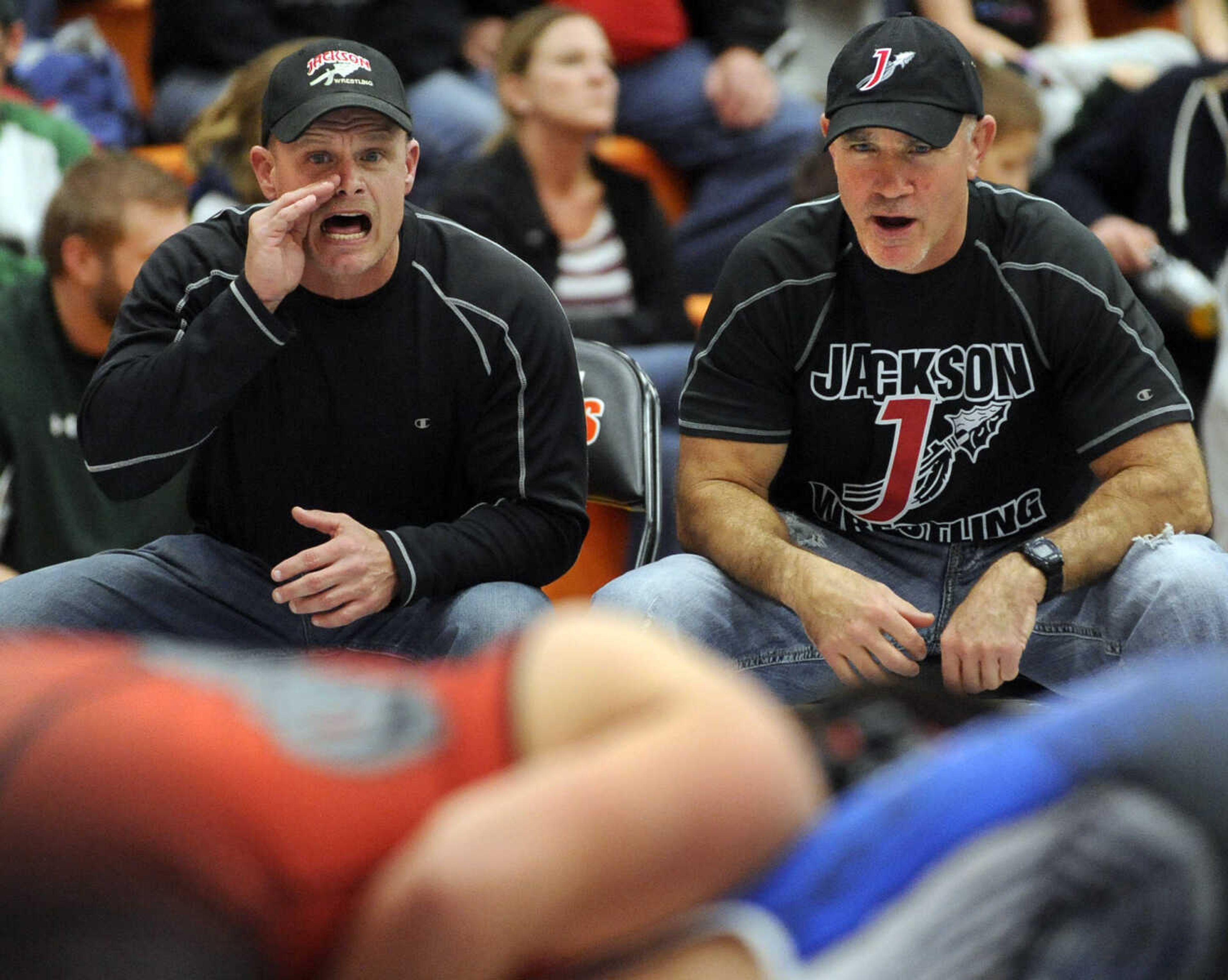 FRED LYNCH ~ flynch@semissourian.com
Jackson wrestling coaches Jerry Golden, left, and Scott Wachter shout instructions to Chris Collier in the 195-pound championship match at the Tiger Classic on Saturday, Dec. 21, 2013 at Central High School.