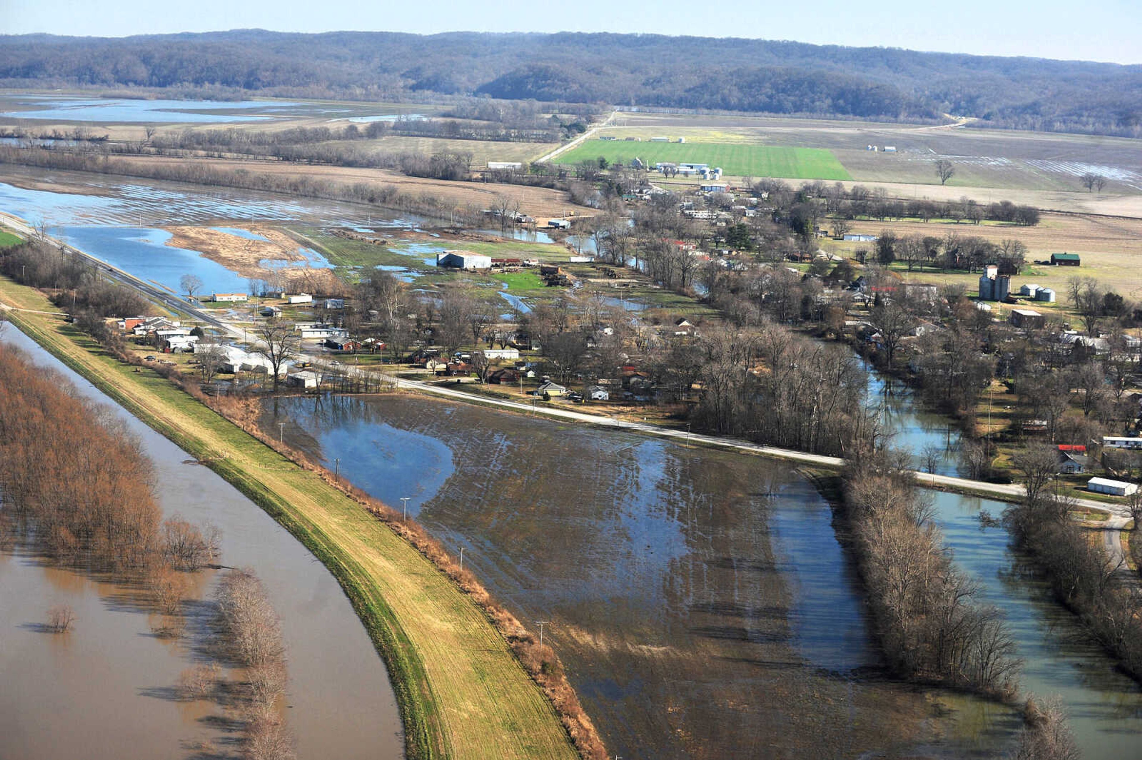 LAURA SIMON ~ lsimon@semissourian.com

Water seeps into portions of McClure, Illinois as the swollen Mississippi River pushes against the levee protecting the Southern Illinois town, Saturday, Jan. 2, 2016.