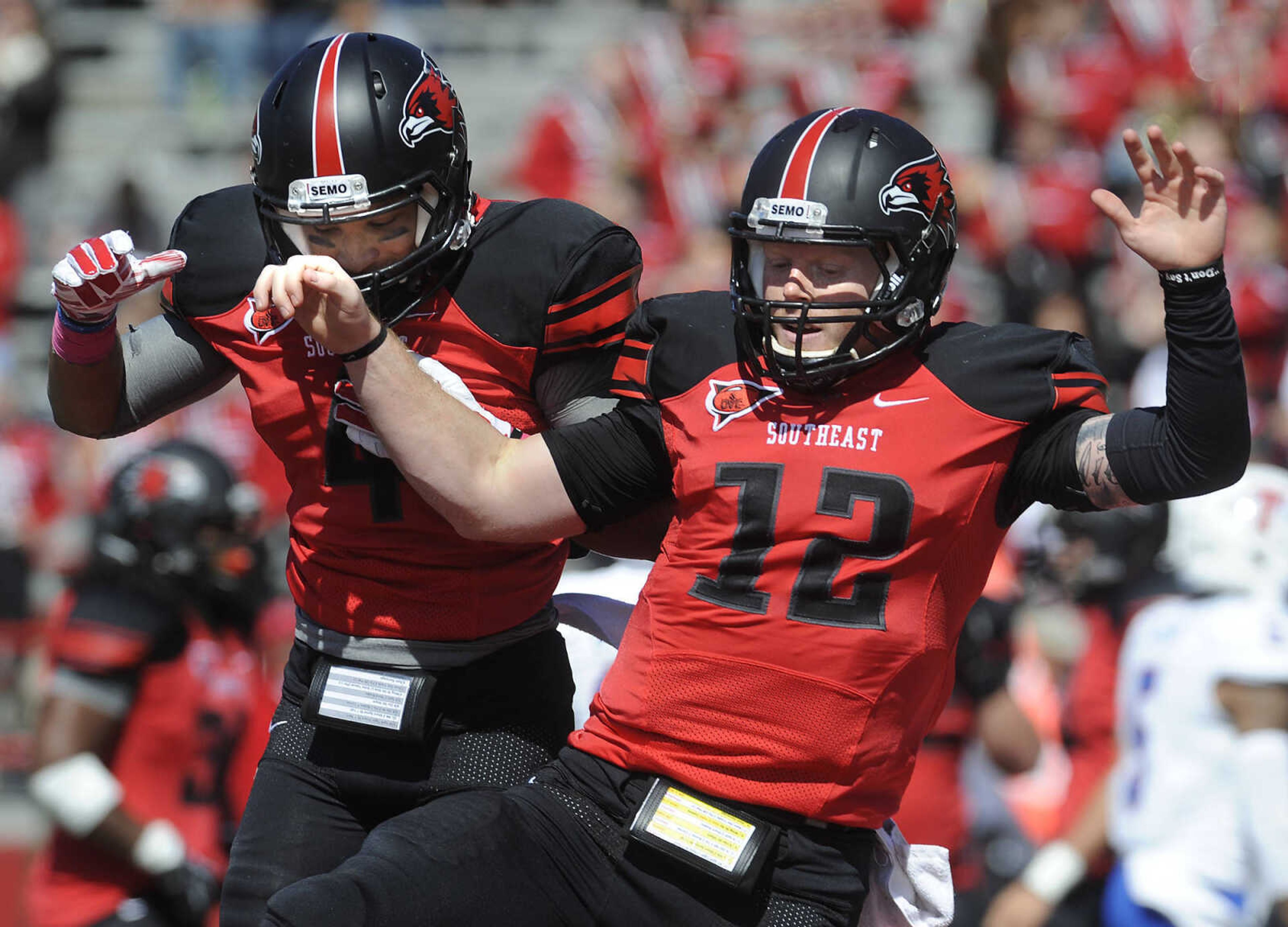 Southeast Missouri State quarterback Kyle Snyder, right, celebrates with Spencer Davis after Snyder scored on a keeper against Tennessee State during the first quarter Saturday, Oct. 4, 2014 at Houck Stadium. (FRED LYNCH)