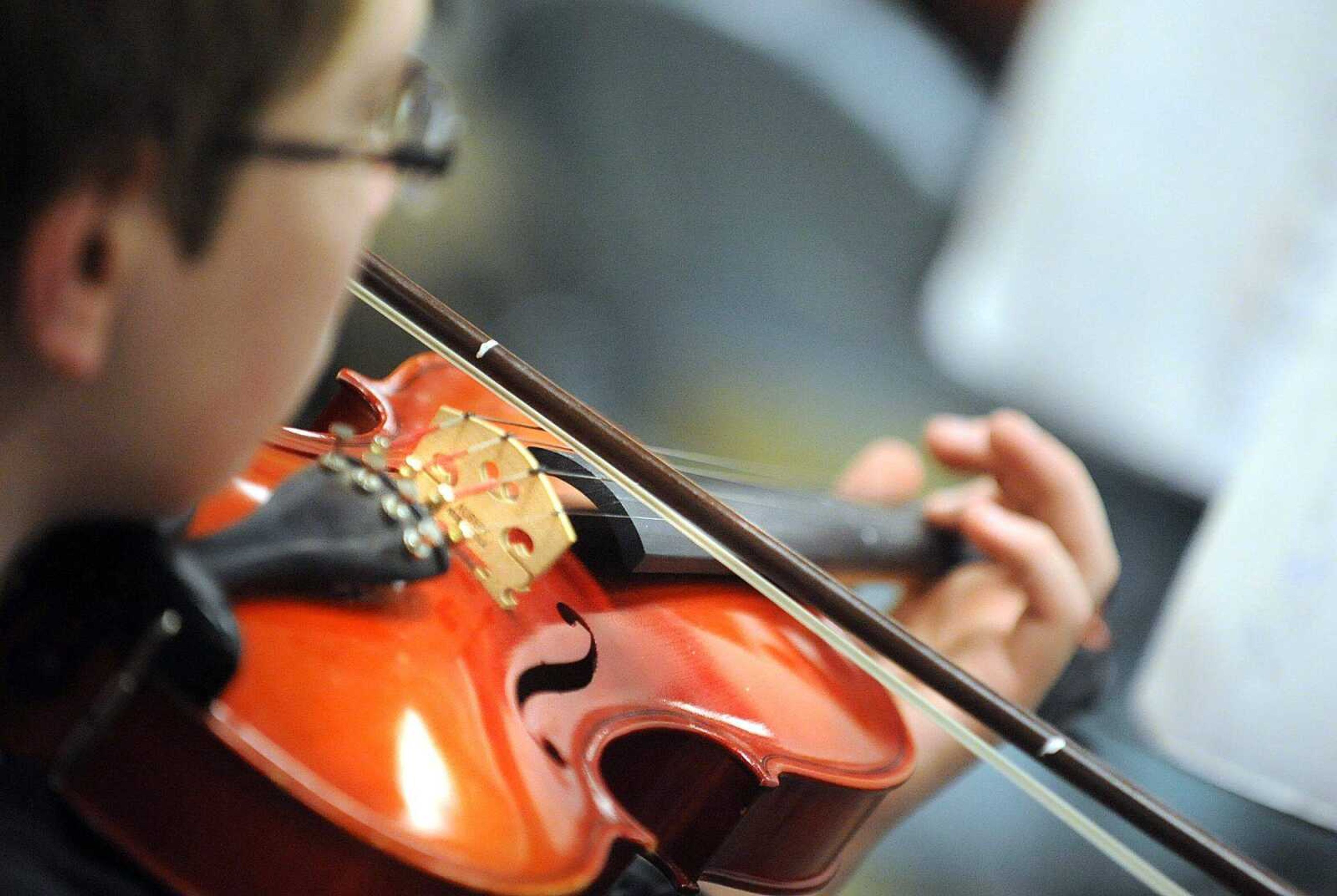 A student plays his viola in one of three beginners classes taught by Steve Schaffner Monday, April 22, 2013 at Cape Central Junior High School. After 22 years of leading the Central High School and Central Junior High School orchestra, Schaffner will be retiring at the end of this school year. (Laura Simon)