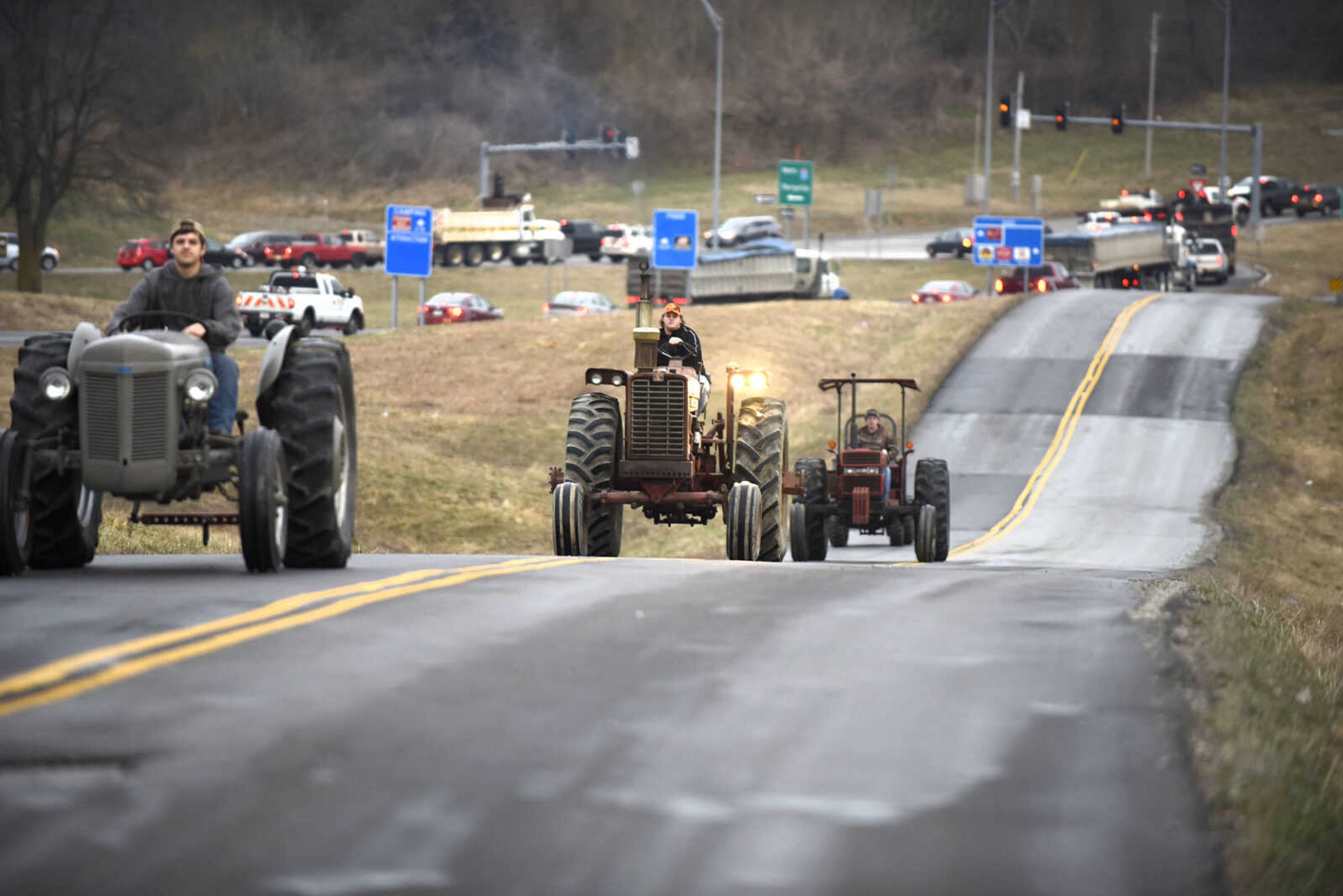 Saxony Lutheran High School FFA students take to the road on their tractors during drive your tractor to school day on Tuesday morning, Feb. 21, 2017. Students began their journey to school from Davis Farm Supply on Highway 61 in Jackson as part of FFA Week.