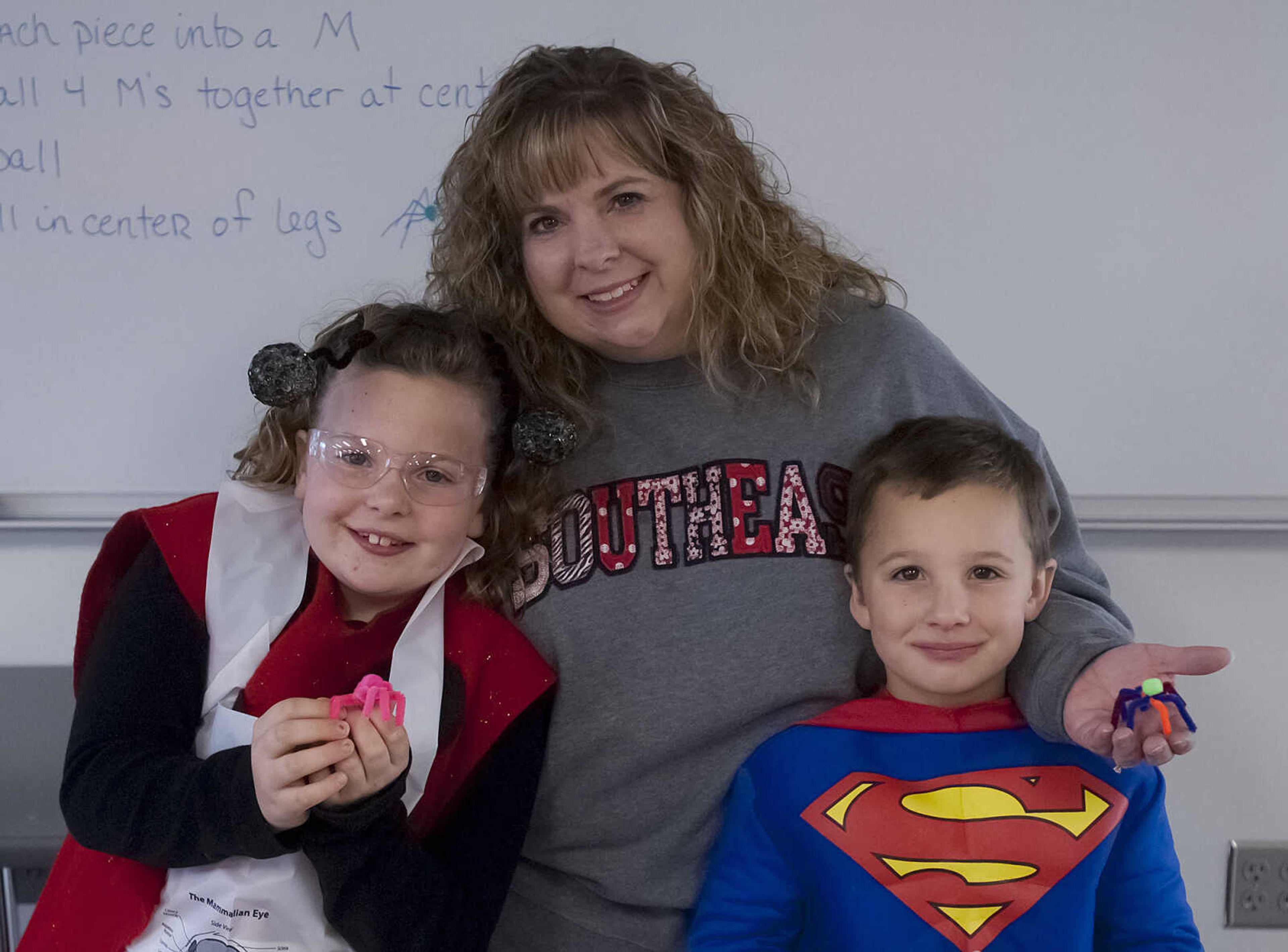 Carsyn Swain, 8, left, Amy Swain and Joshua Swain, 5, at the fifth annual Halloween Science Night Sunday, Oct. 20, on the campus of Southeast Missouri State University.