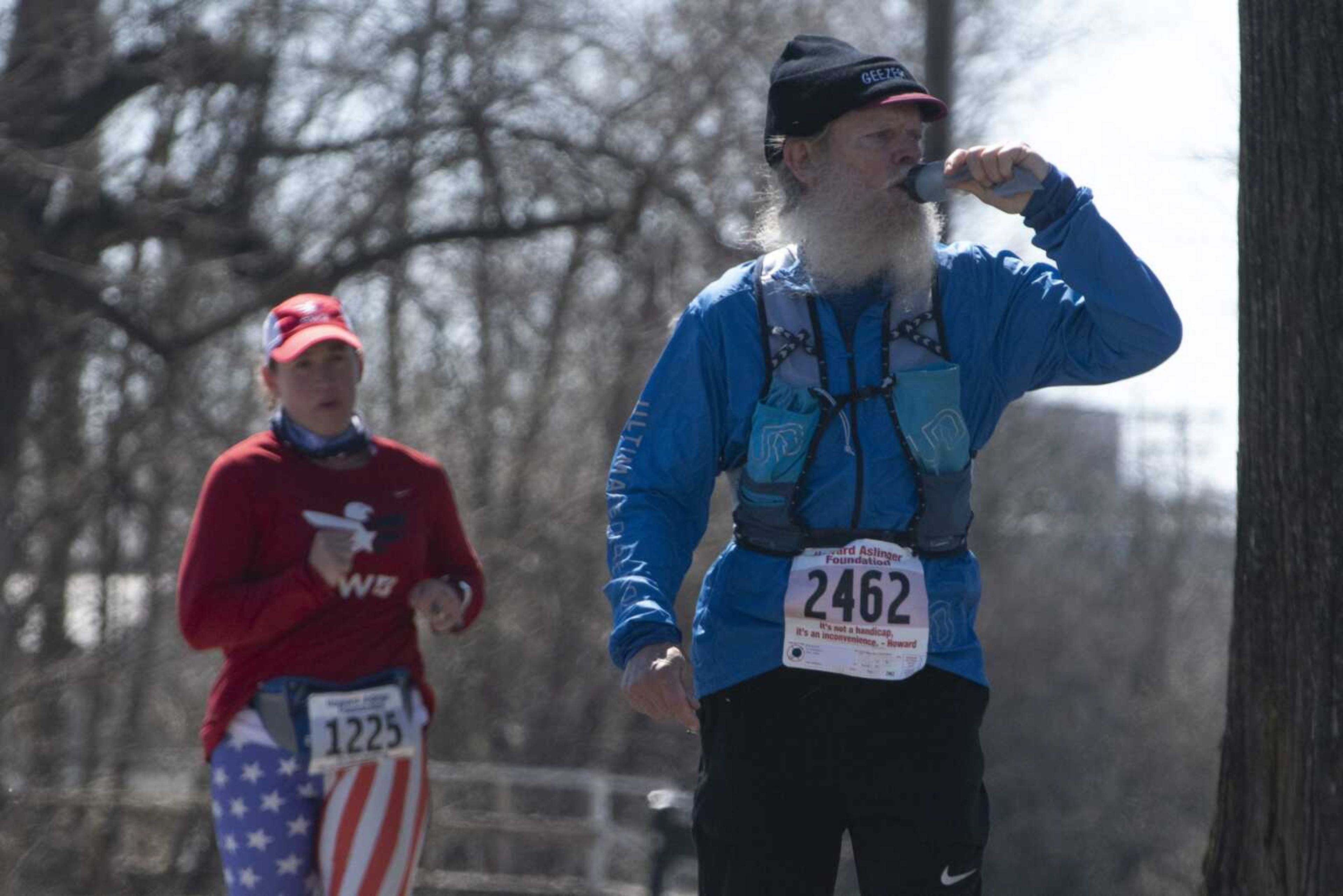 Bob Somers of Bowling Green, Kentucky, hydrates next to Amanda Lowery of Carbondale, Illinois, during the 10th annual Howard Aslinger Endurance Run on Saturday, March 16, 2019, at Arena Park in Cape Girardeau.