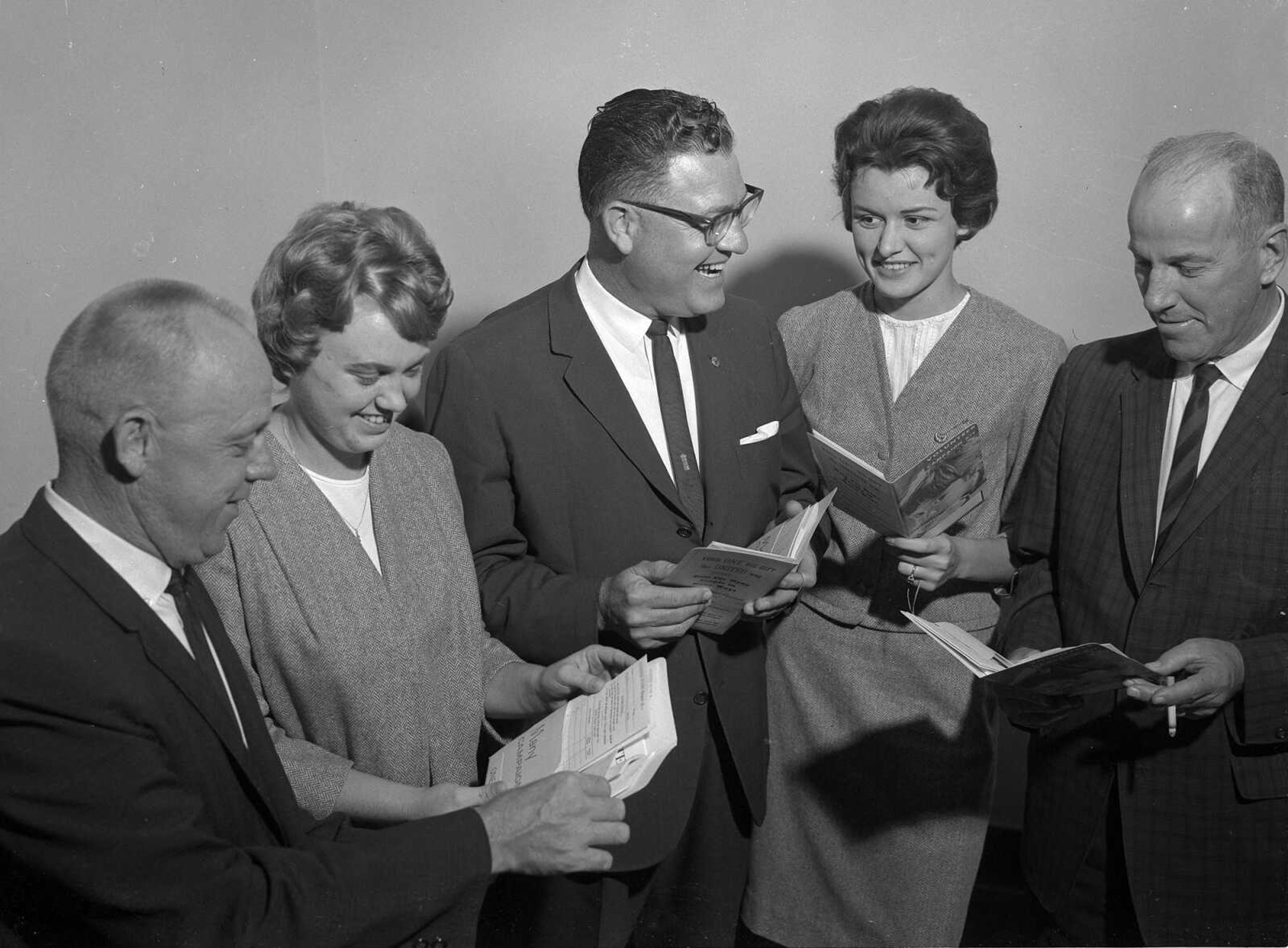 This group of volunteers is focused on its United Way campaign kits. Vicki Outman wrote: "The two ladies are Susan Bohnsack (later Cole), and on the right, Carole Harrelson (Meyers). They were both Tri-Delta's at SEMO and were wearing the formal suit in aqua blue that Tri-Delts wore for dress events. That would have been in 1963 or 1964. They were sorority sisters of mine."