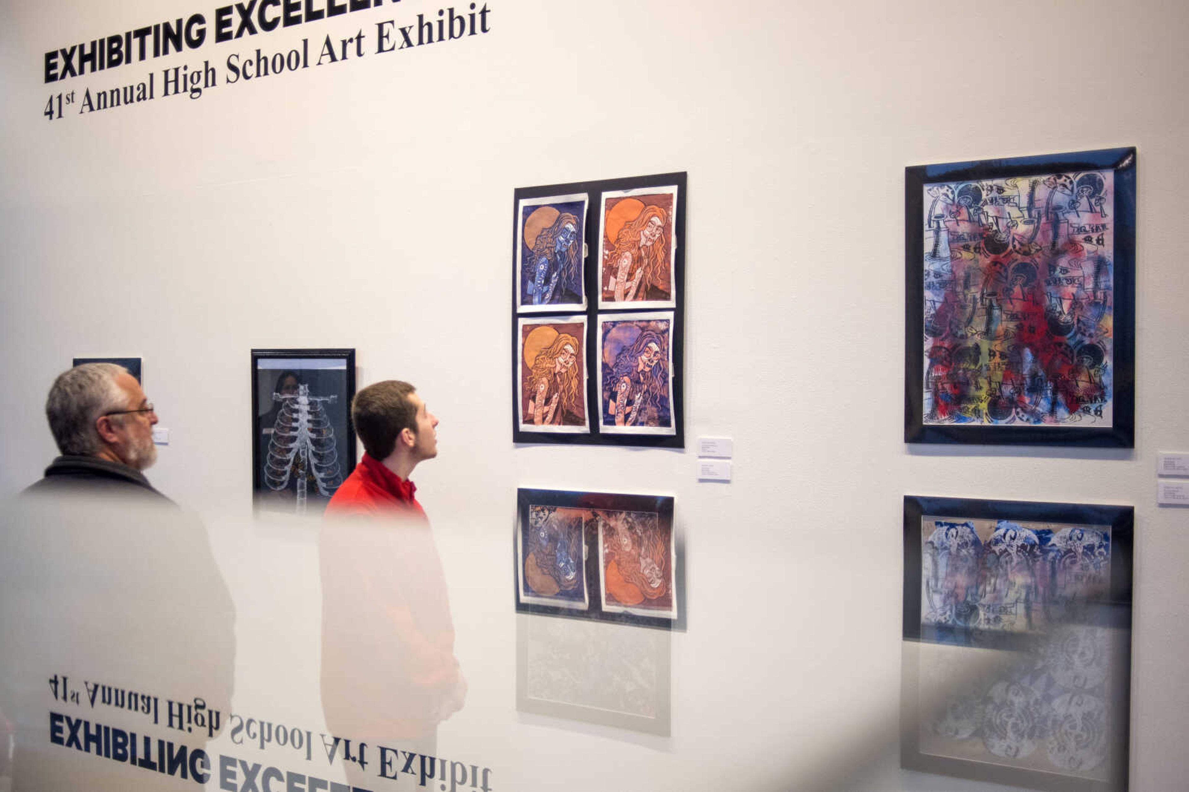 Visitors look at pieces of art during the 41st annual Exhibiting Excellence high school art exhibit at the Crisp Museum at Southeast Missouri State University's River Campus Sunday, Feb. 10, 2019.