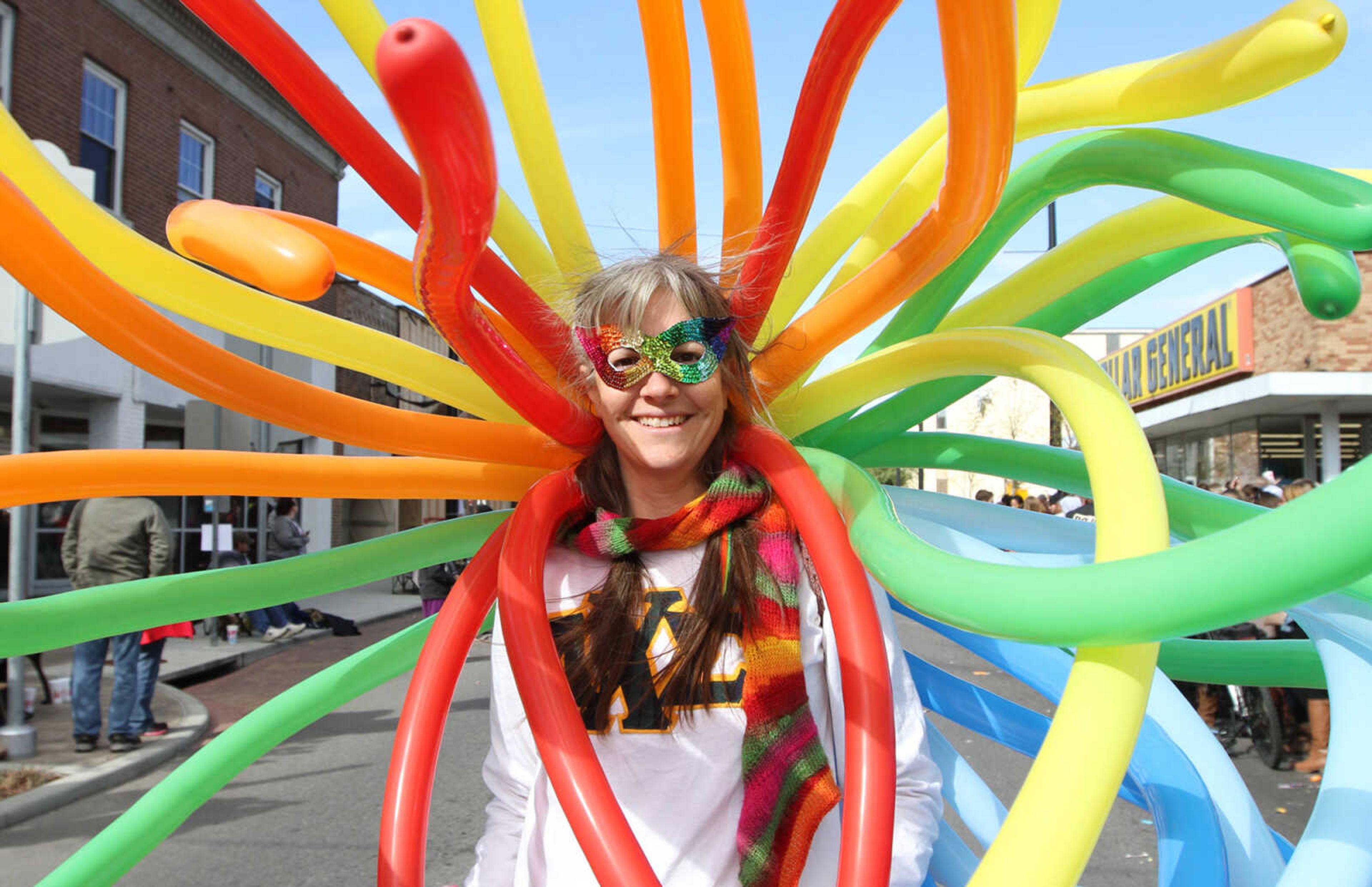 GLENN LANDBERG ~ glandberg@semissourian.com

Rachel Theall, professor of chemistry at Southeast Missouri State University, walks down Broadway dressed as the periodic table of elements for the homecoming parade Saturday morning, Oct. 4, 2014.