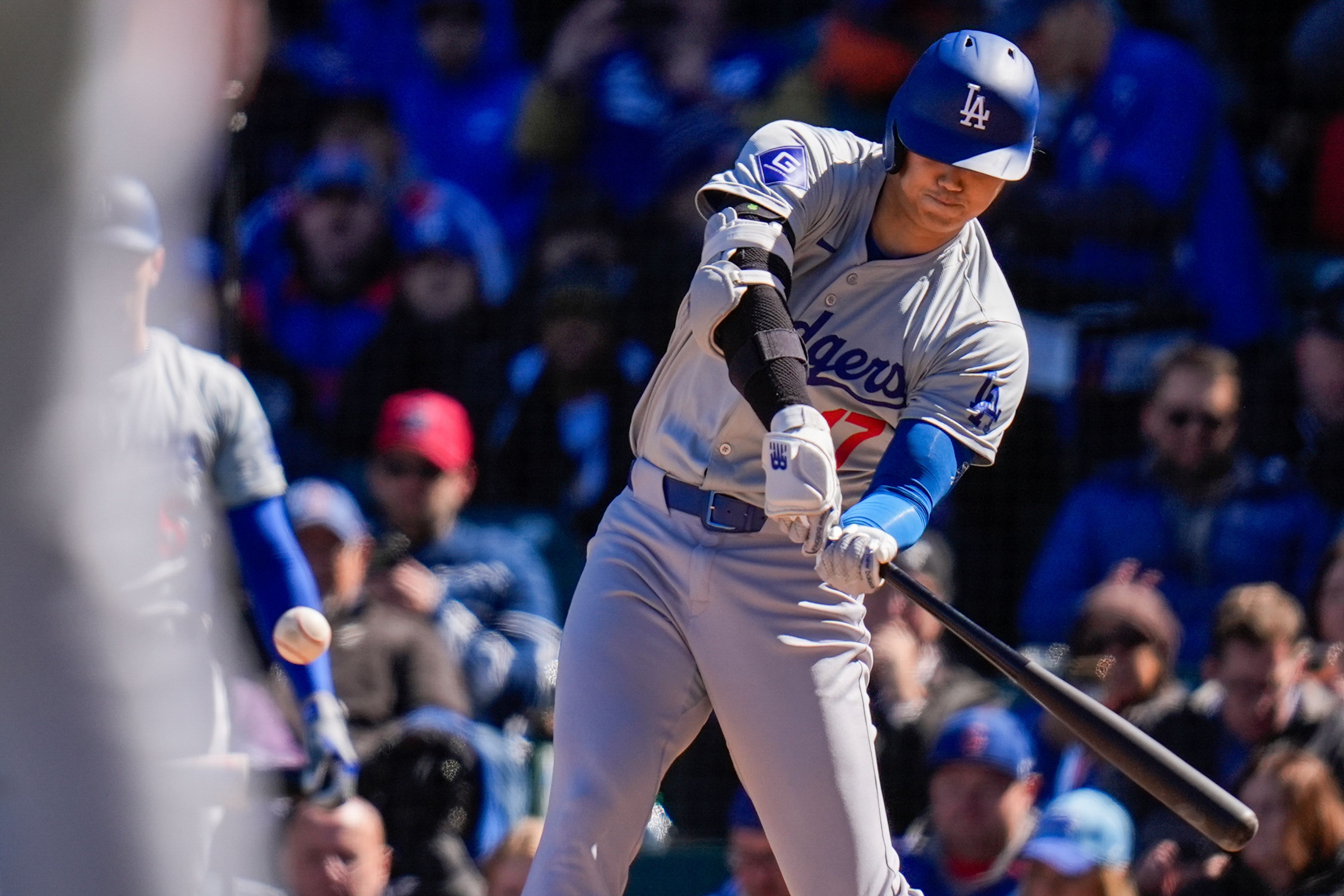 Los Angeles Dodgers' Shohei Ohtani hits a home run during the fifth inning of a baseball game against the Chicago Cubs, Friday, April 5, 2024, in Chicago. (AP Photo/Erin Hooley)