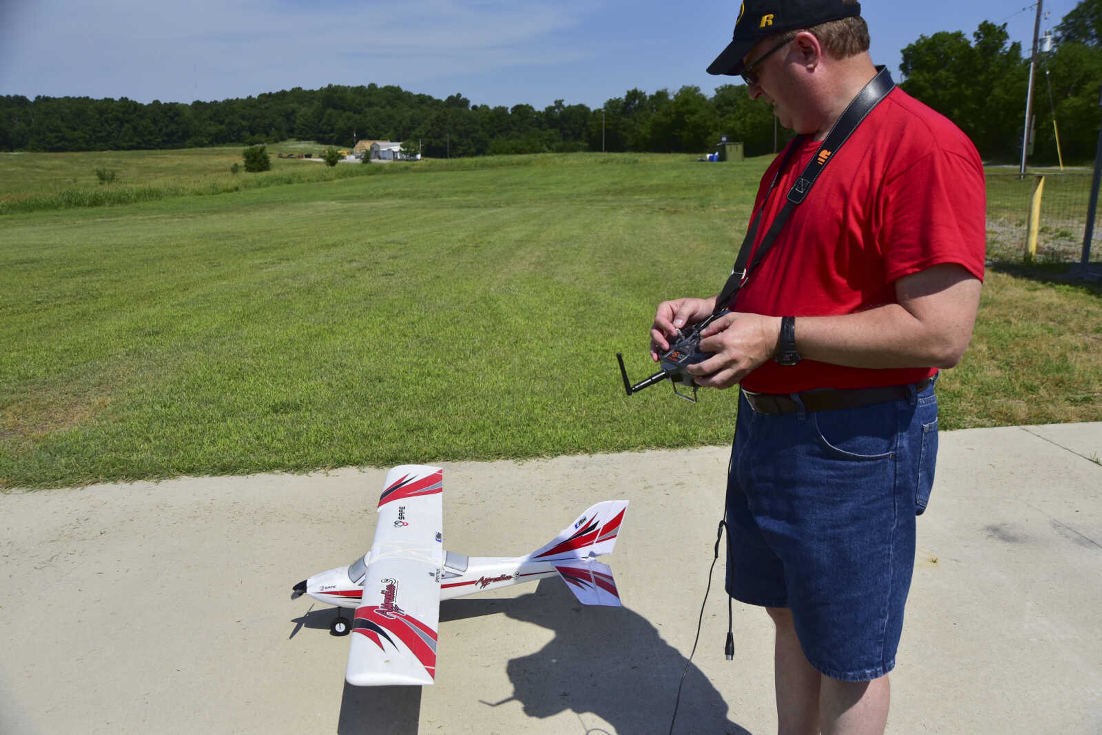 Mark McCoy prepares for takeoff for the Cape Fly Hi radio controlled aircraft demonstration Saturday, June 3, 2017 at Galaxy Park in Cape Girardeau.