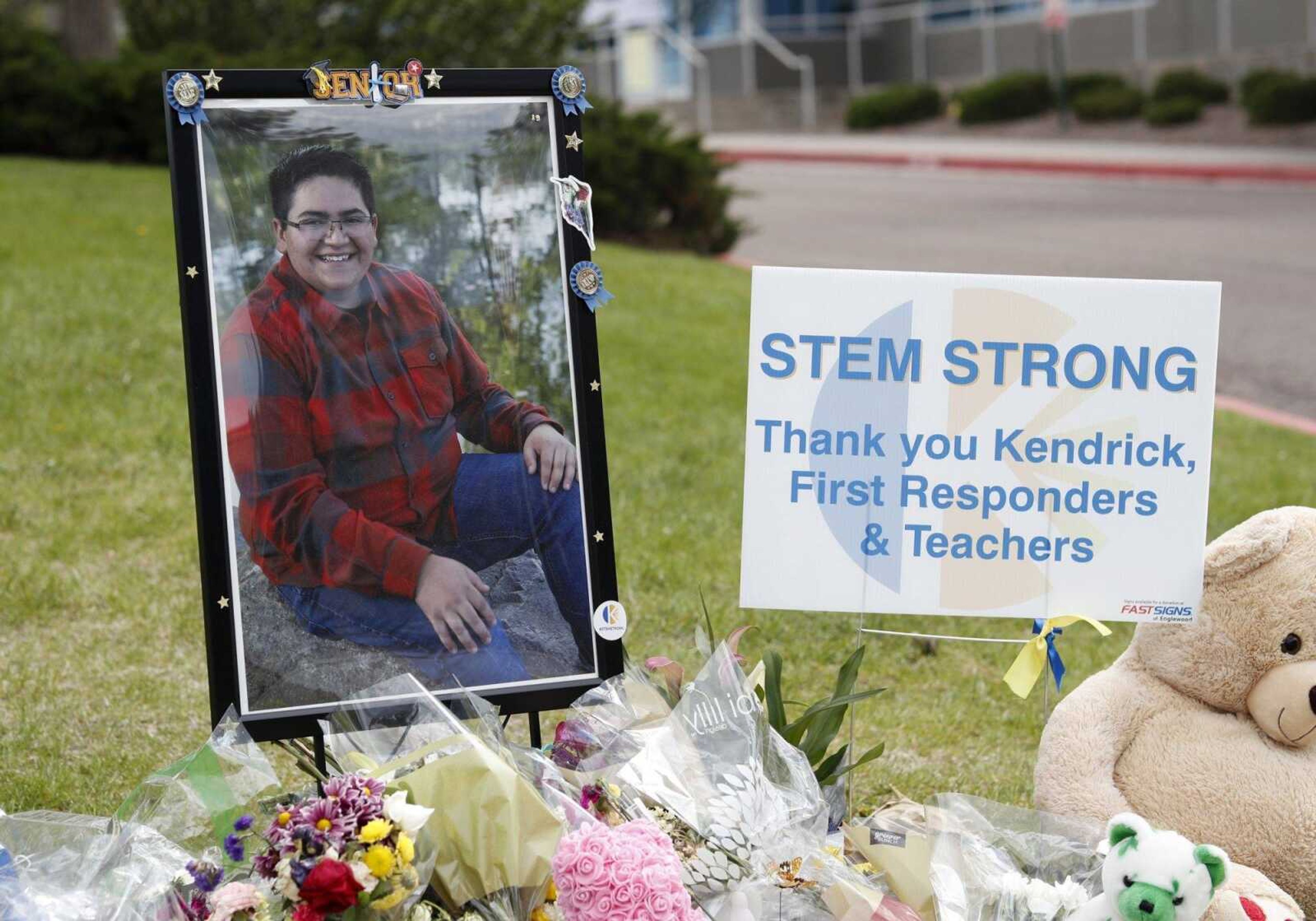 A photograph of student Kendrick Castillo stands amid a display of tributes outside the STEM School Highlands Ranch a week after the attack on the school left Castillo dead and others injured in Highlands Ranch, Colorado.