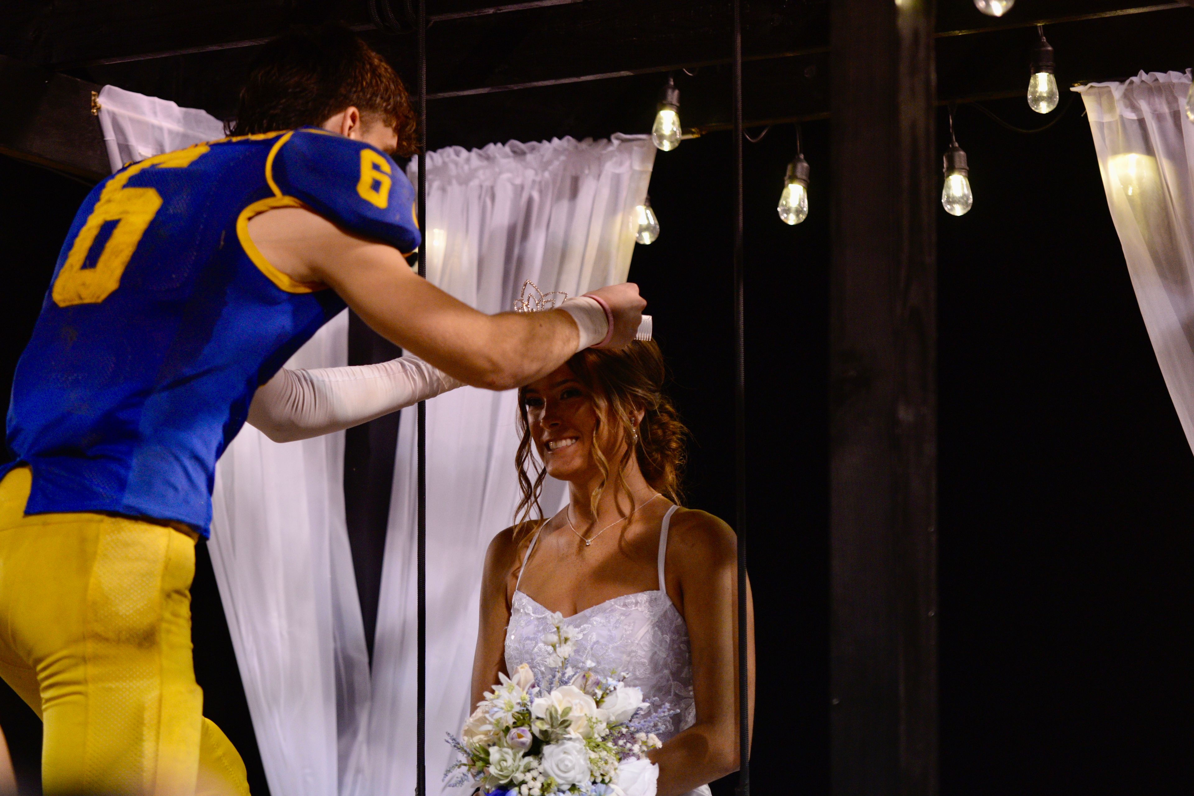 St. Vincent homecoming king Clayton Gremaud presents crown to homecoming queen Mallory Patrick on Friday, Oct. 11, in Perryville. 