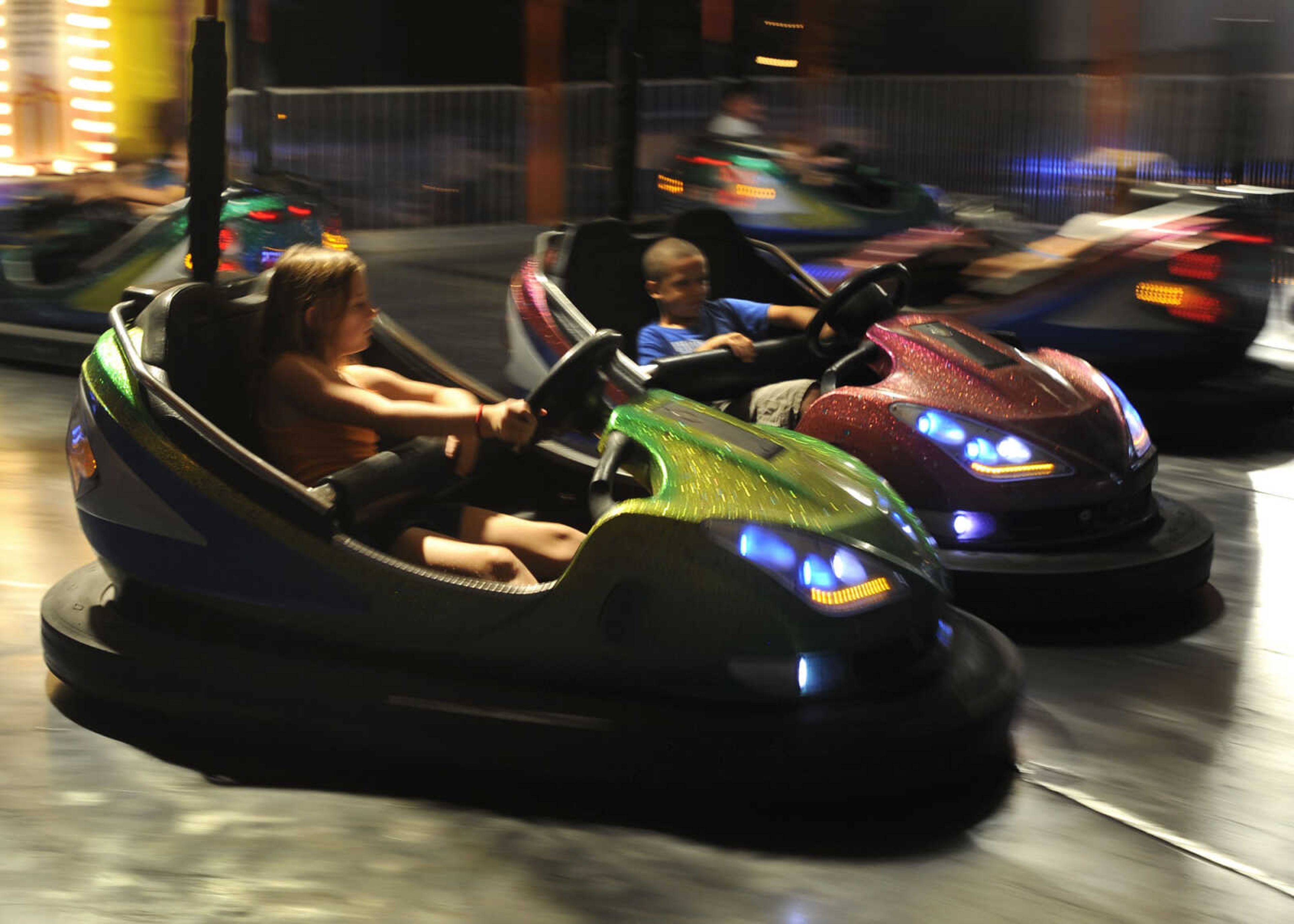 FRED LYNCH ~ flynch@semissourian.com
Drivers floor it with the bumper cars at Homecomers Friday, July 29, 2011.