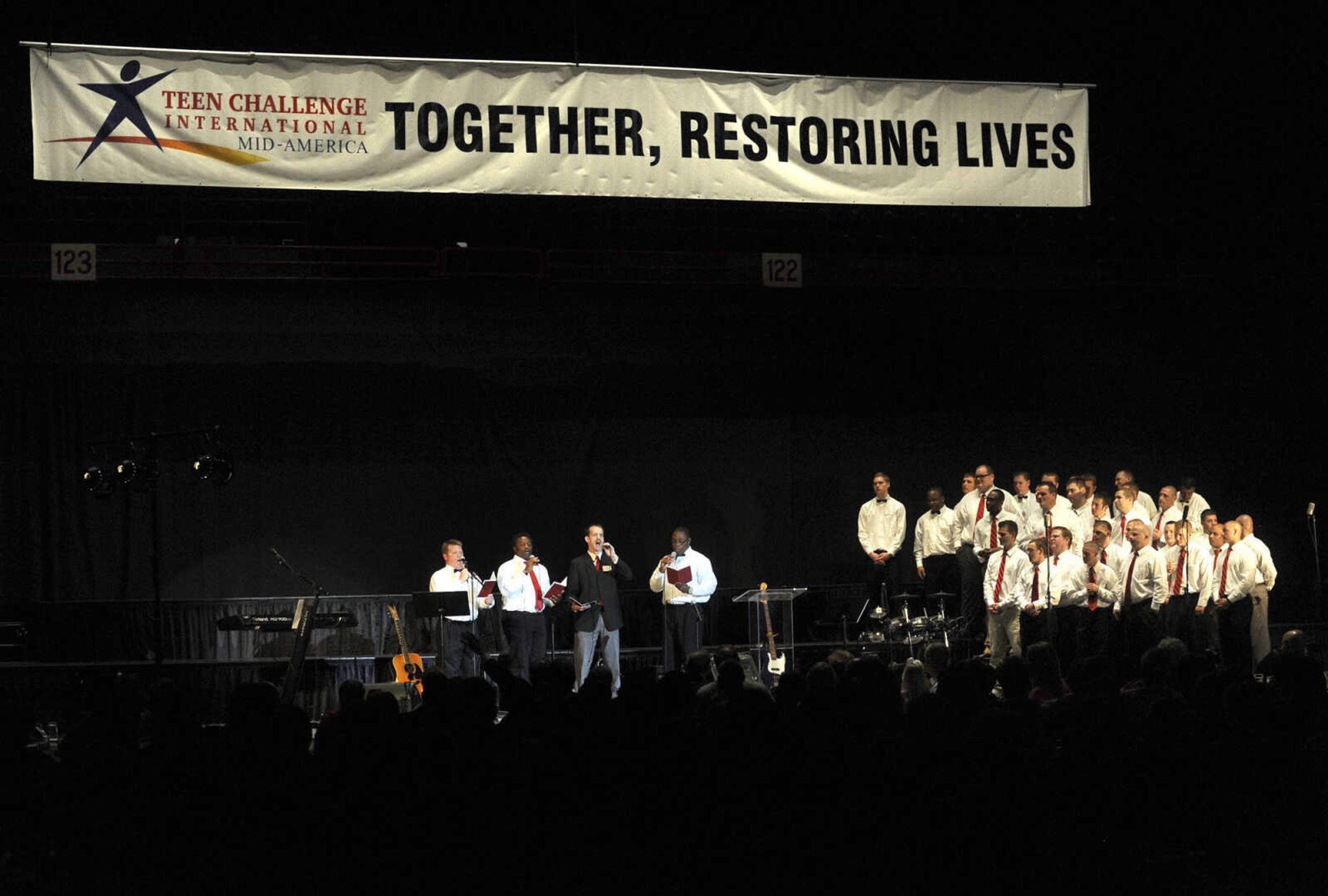 Teen Challenge alumnus John Bechtel leads a quartet with the Teen Challenge Mid America Choir at the ministry's annual banquet Saturday, April 13, 2013 at the Show Me Center. (Fred Lynch)