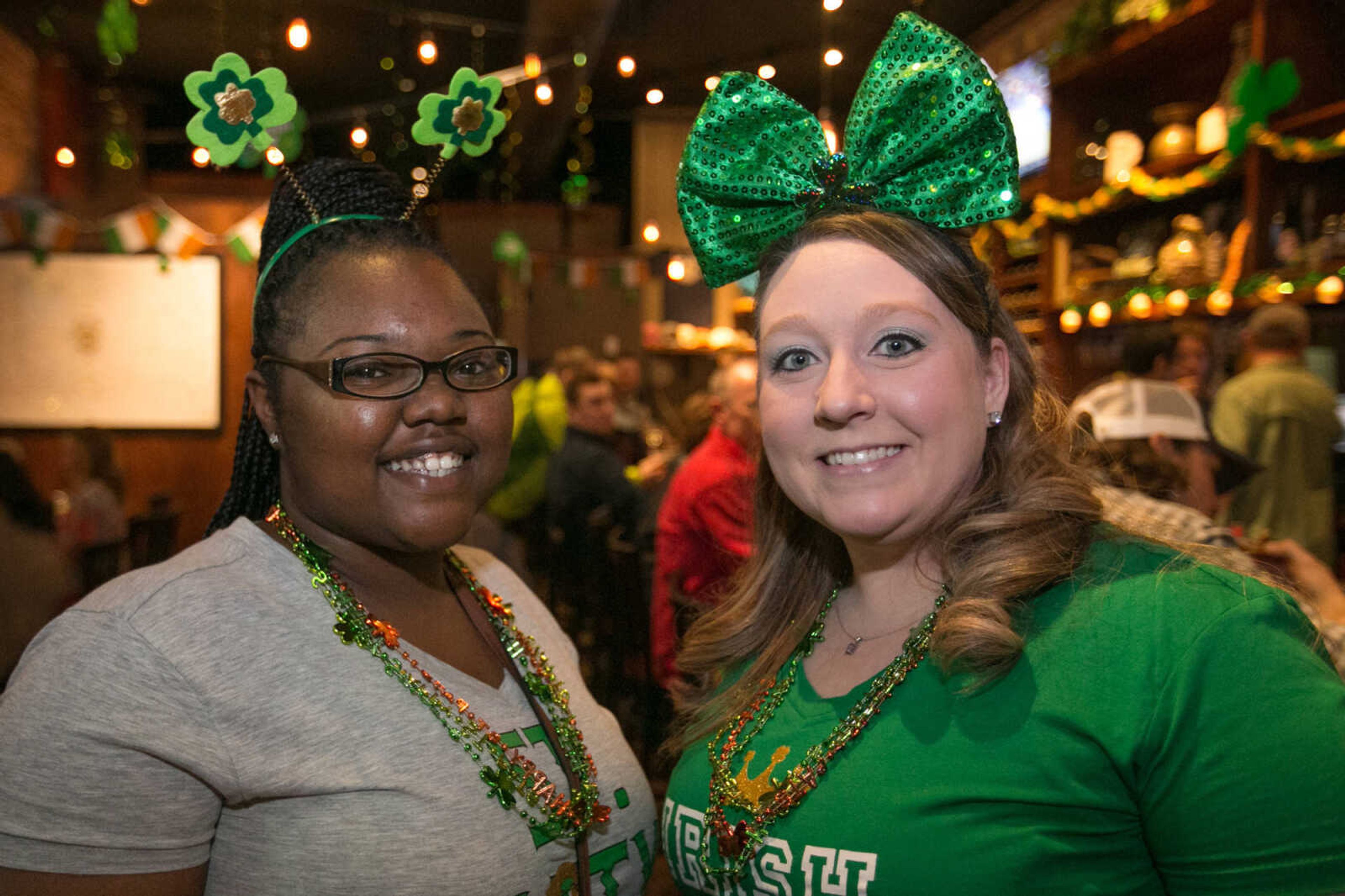 GLENN LANDBERG ~ glandberg@semissourian.com

Angelic Davis, left, and Enjoli Paxton pose for a photo during the St. Patrick's Day Pub Crawl in downtown Cape Girardeau Thursday, March 17, 2016.