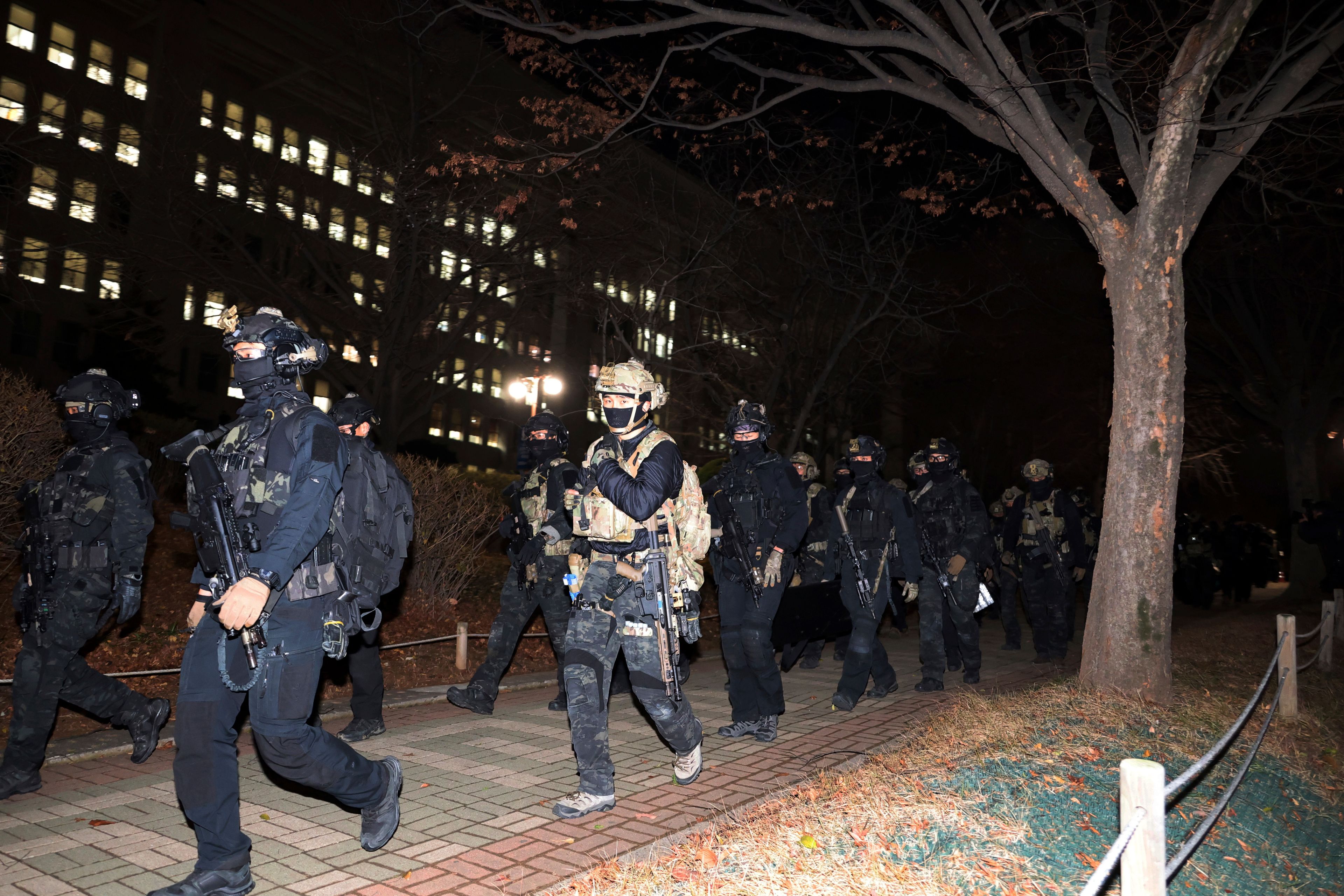 South Korean martial law soldiers leave the National Assembly in Seoul, South Korea, Wednesday, Dec. 4, 2024. (Kim Ju-sung/Yonhap via AP)