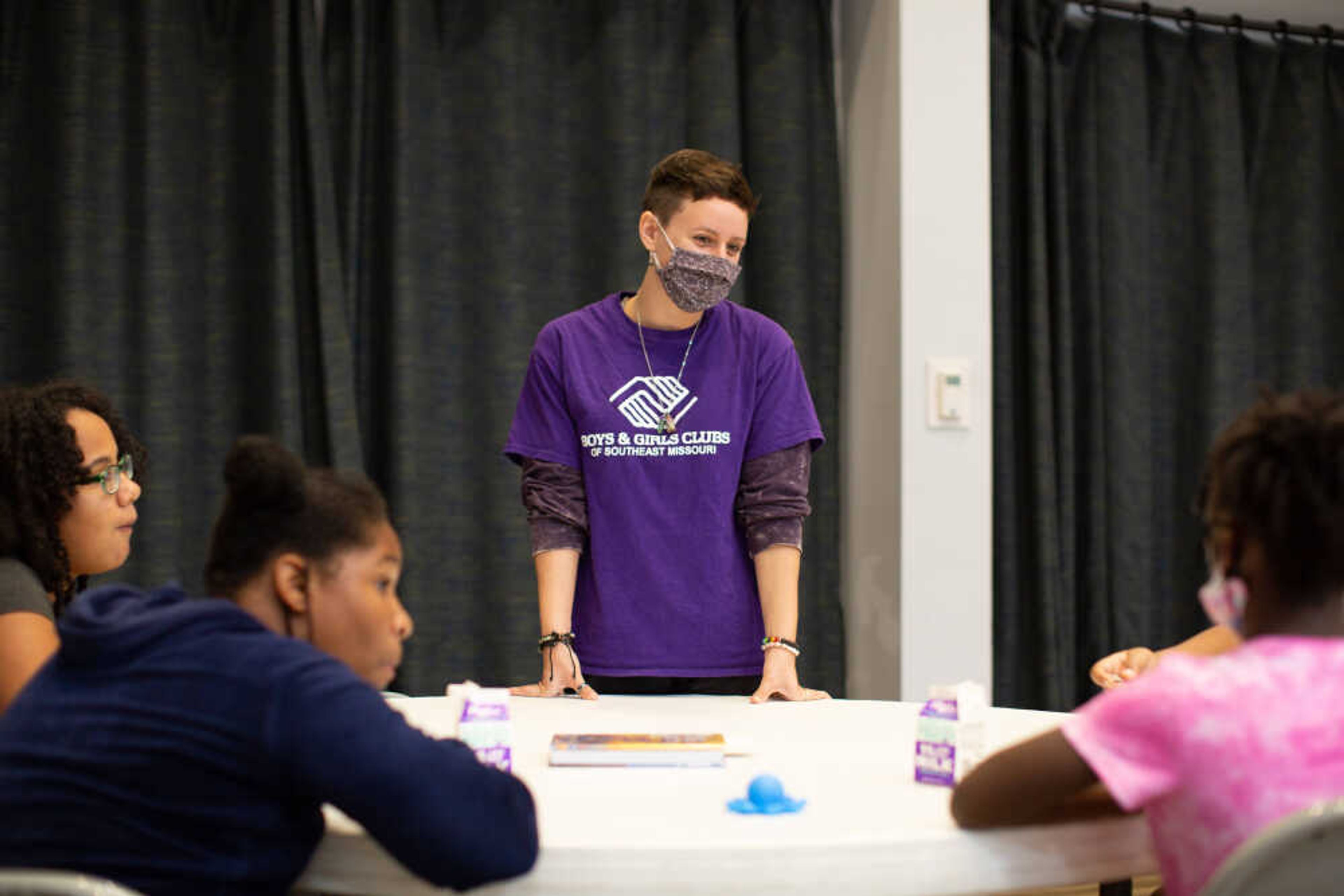 A worker talks with kids at the Boys and Girls Clubs of Southeast Missouri in October 2021.