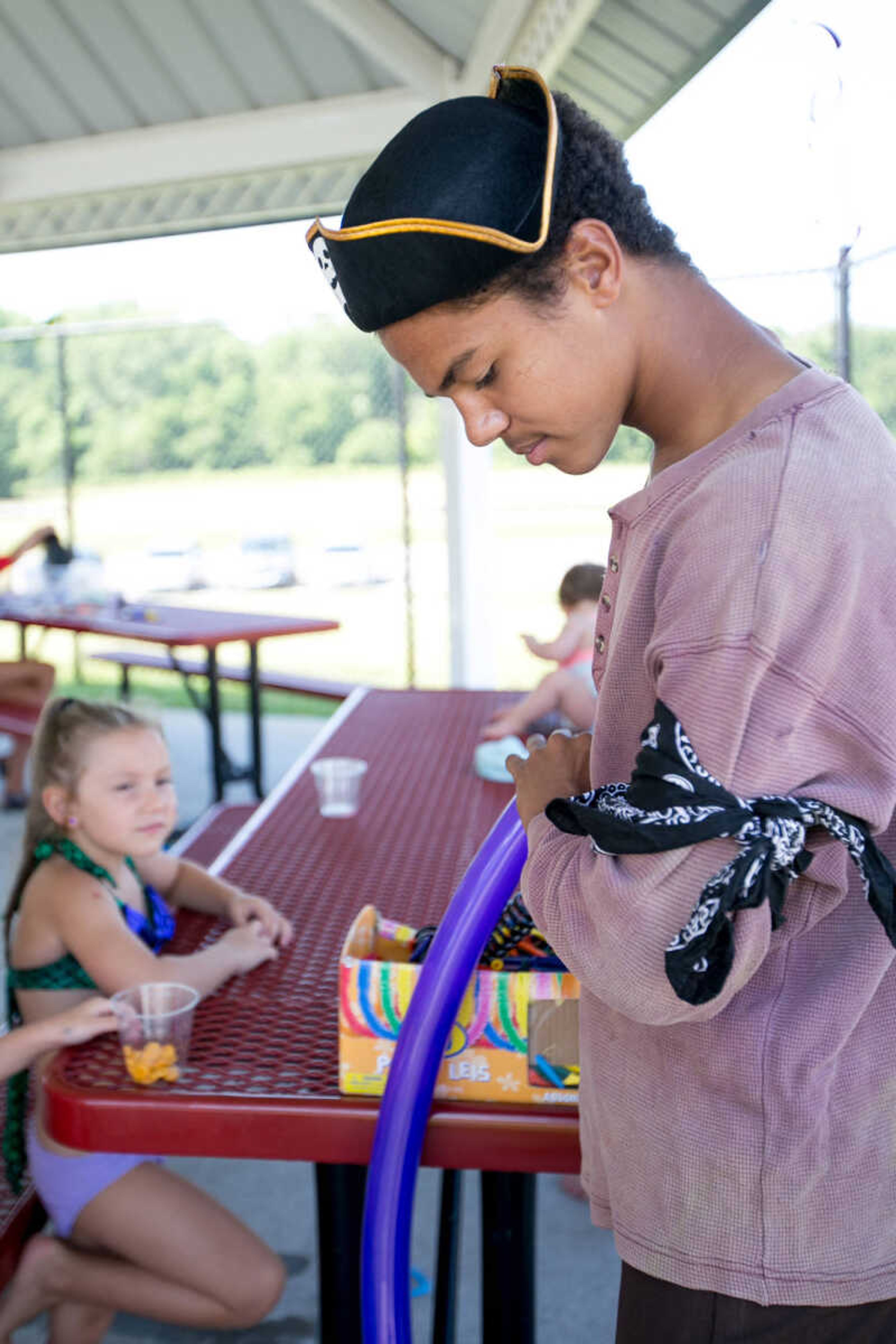 GLENN LANDBERG ~ glandberg@semissourian.com

Joseph Reed makes a balloon sword for young kids during the Mermaid and Pirate Party at Cape Splash Saturday, June 18, 2016 in Cape Girardeau.