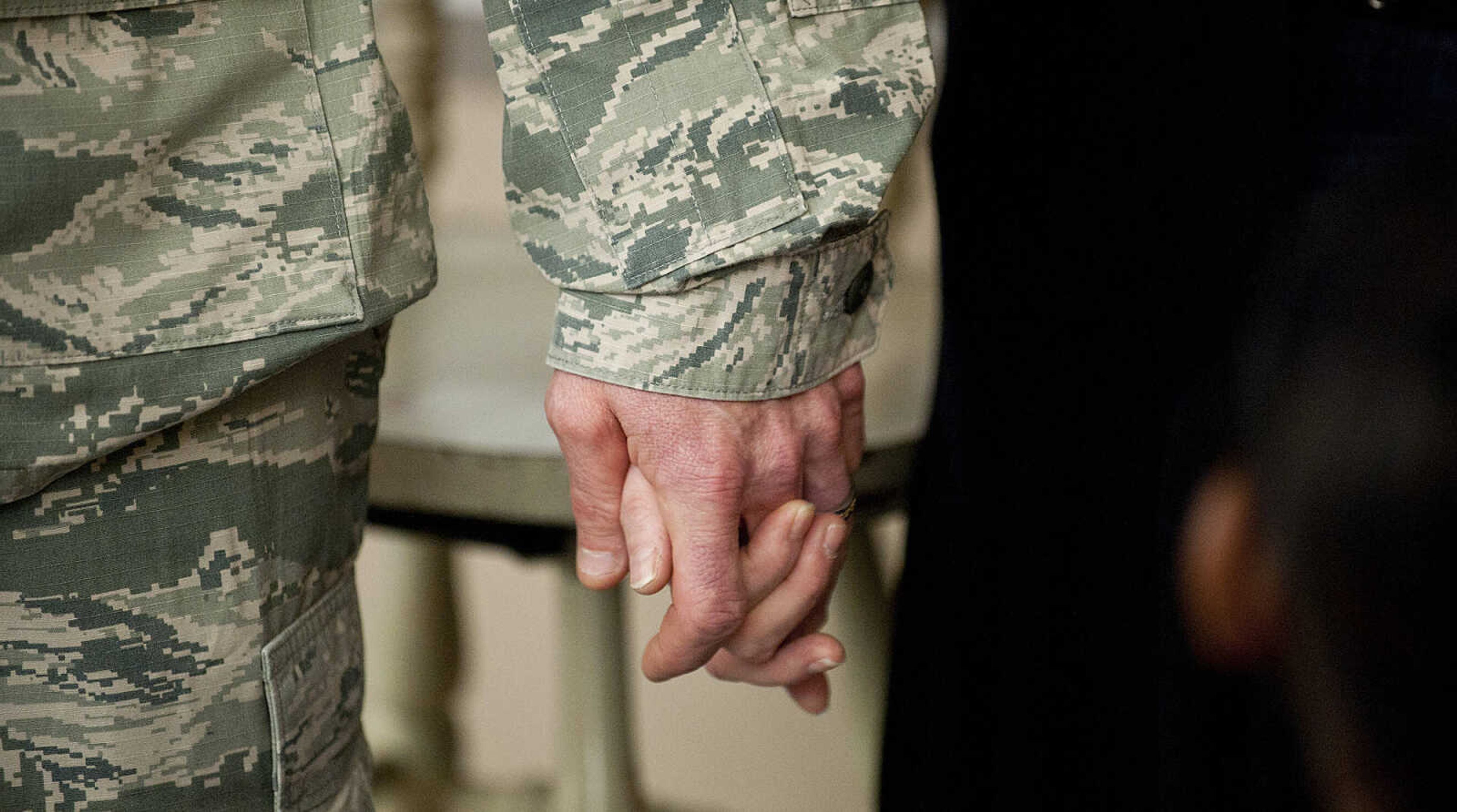 Command Chief Master Sgt. Geoff Weimer and his wife LeAnne hold hands after surprising their son Eli, 9, in his fourth grade class, Friday, March 14, at Franklin Elementary School in Cape Girardeau. Sgt. Weimer is on leave from the Air Force after being deployed in the Middle East since Oct., and surprised his three sons, Geordan, 11, Eli, 9, and Gabriel, 6, in their respective classes.