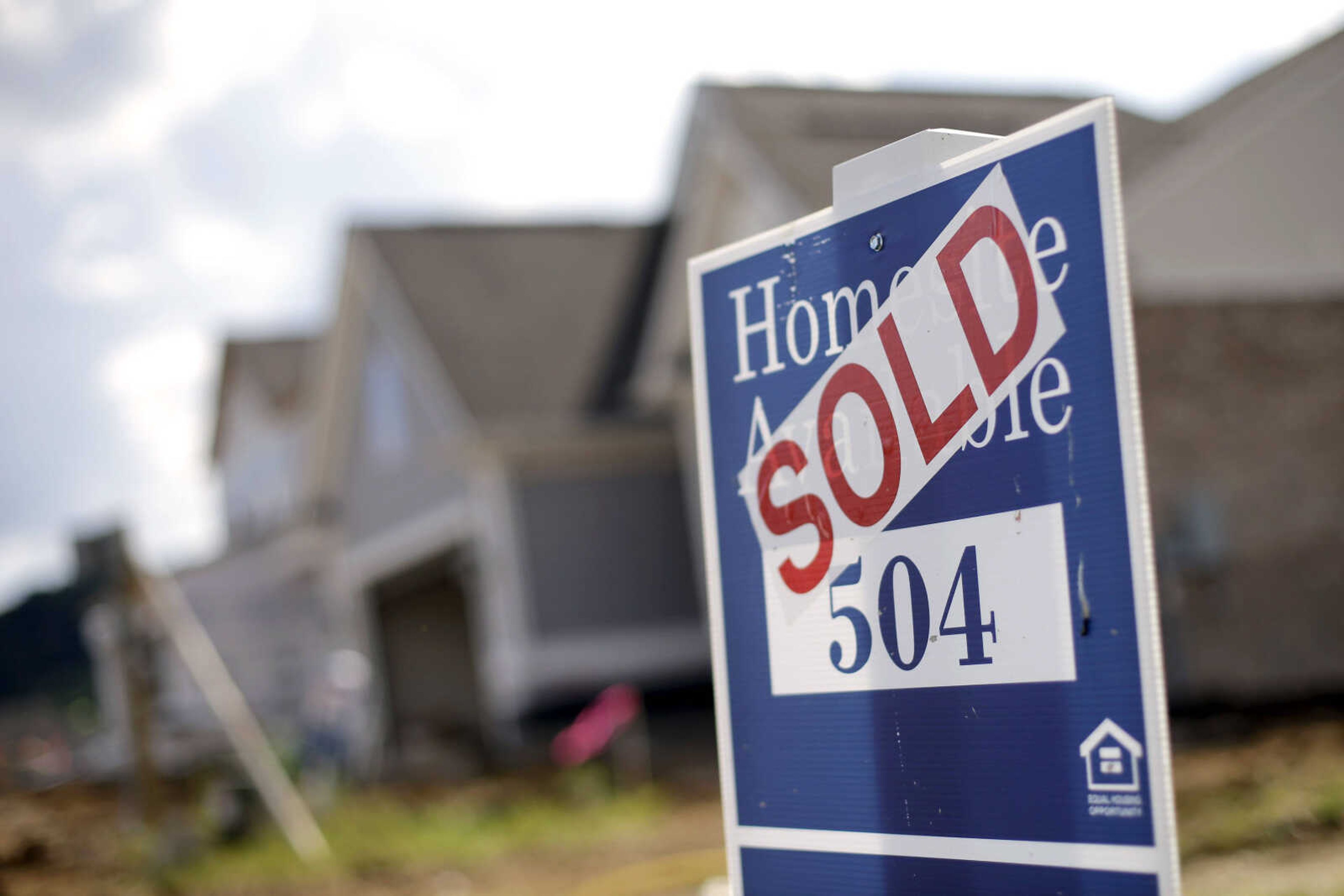 A sign indicates a site has been sold in a new home development June 4, 2015, in Nashville, Tennessee.