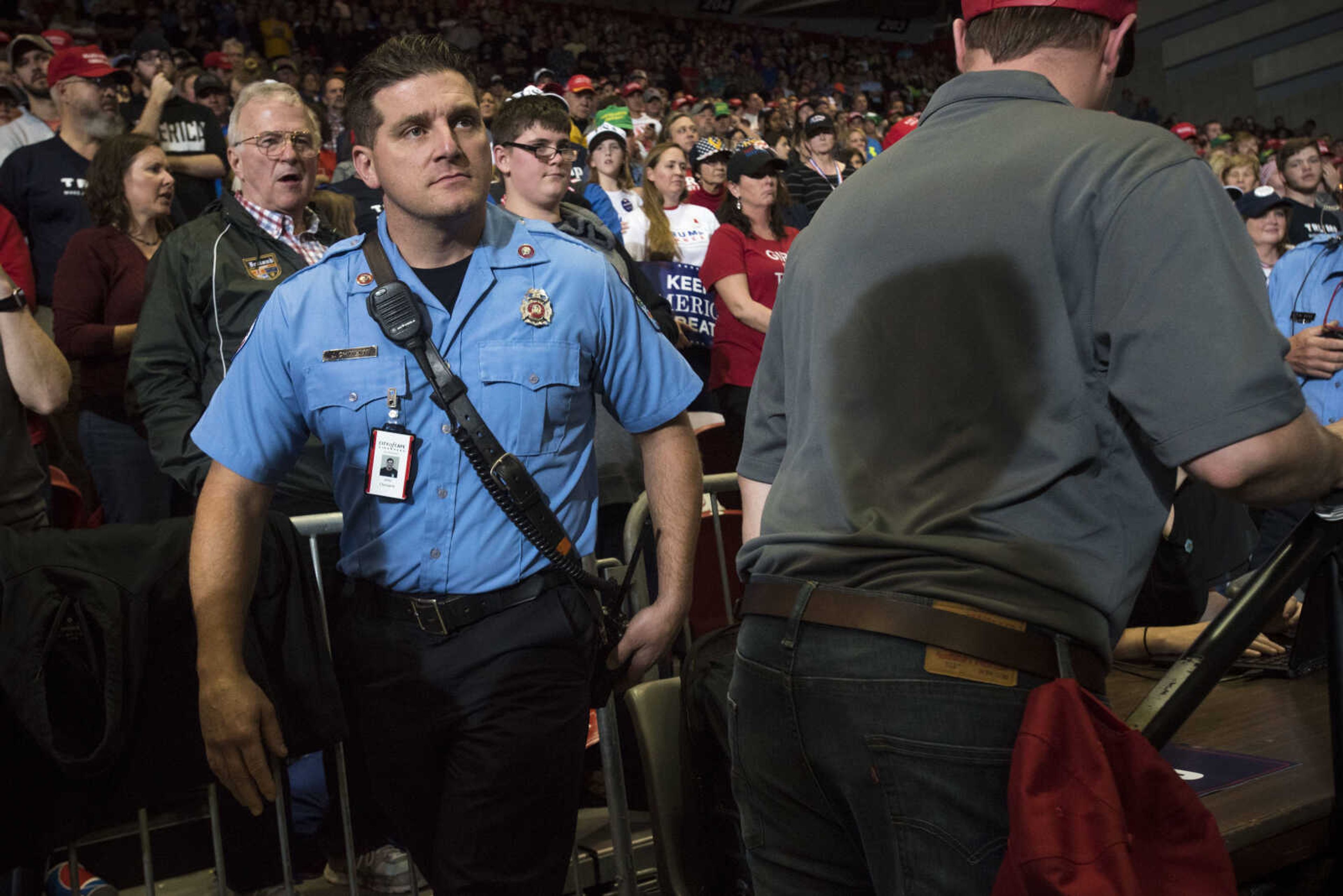 Cape Girardeau firefighter John Chimienti makes his way into the crowd to provide medical attention to an attendee at a Make America Great Again rally Monday, Nov. 5, 2018, at the Show Me Center in Cape Girardeau.