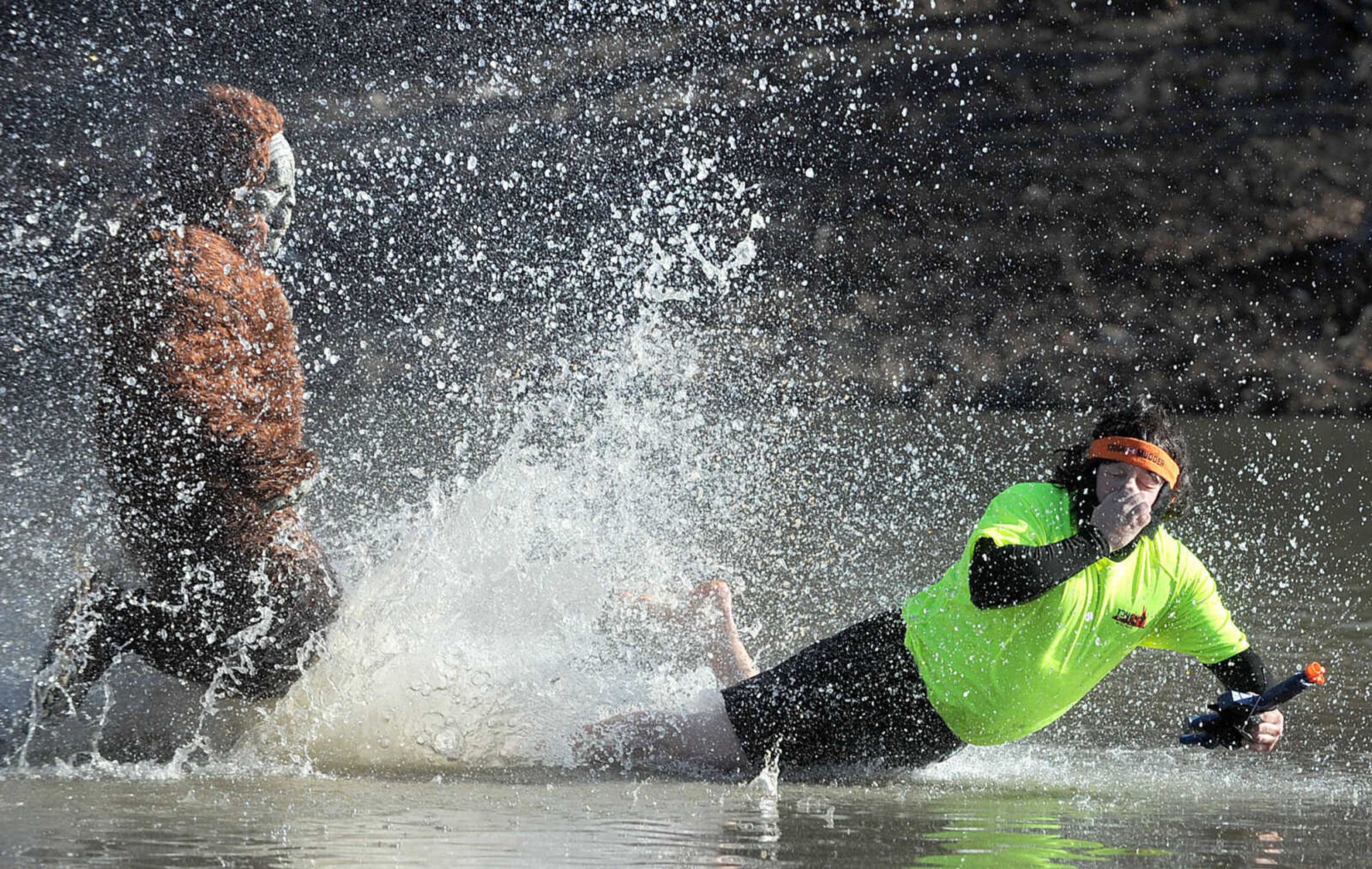 LAURA SIMON ~ lsimon@semissourian.com
People plunge into the cold waters of Lake Boutin Saturday afternoon, Feb. 2, 2013 during the Polar Plunge at Trail of Tears State Park. Thirty-six teams totaling 291 people took the annual plunge that benefits Special Olympics Missouri.