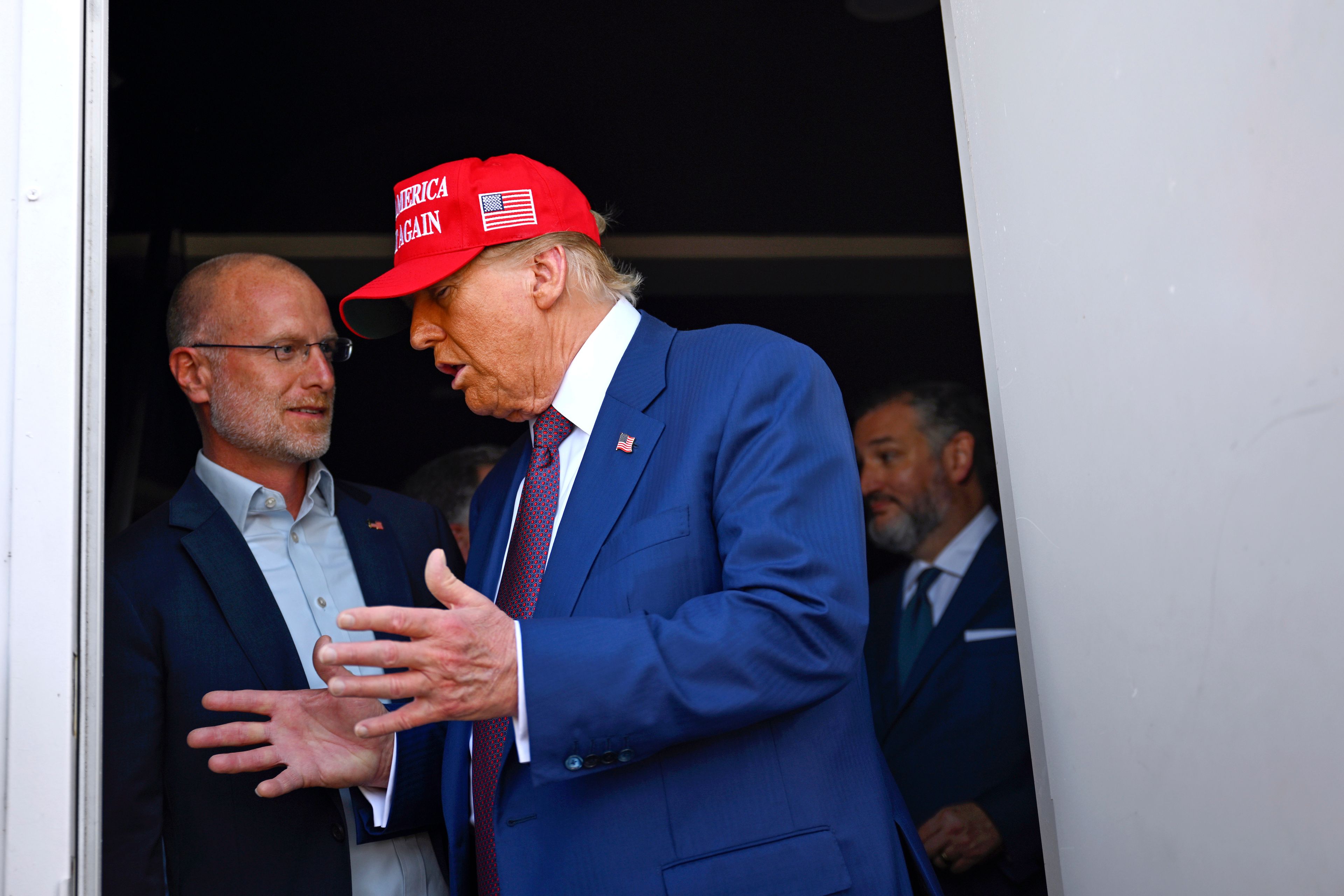 President-elect Donald Trump speaks with talks with Brendan Carr before the launch of the sixth test flight of the SpaceX Starship rocket Tuesday, Nov. 19, 2024 in Brownsville, Texas. (Brandon Bell/Pool via AP)