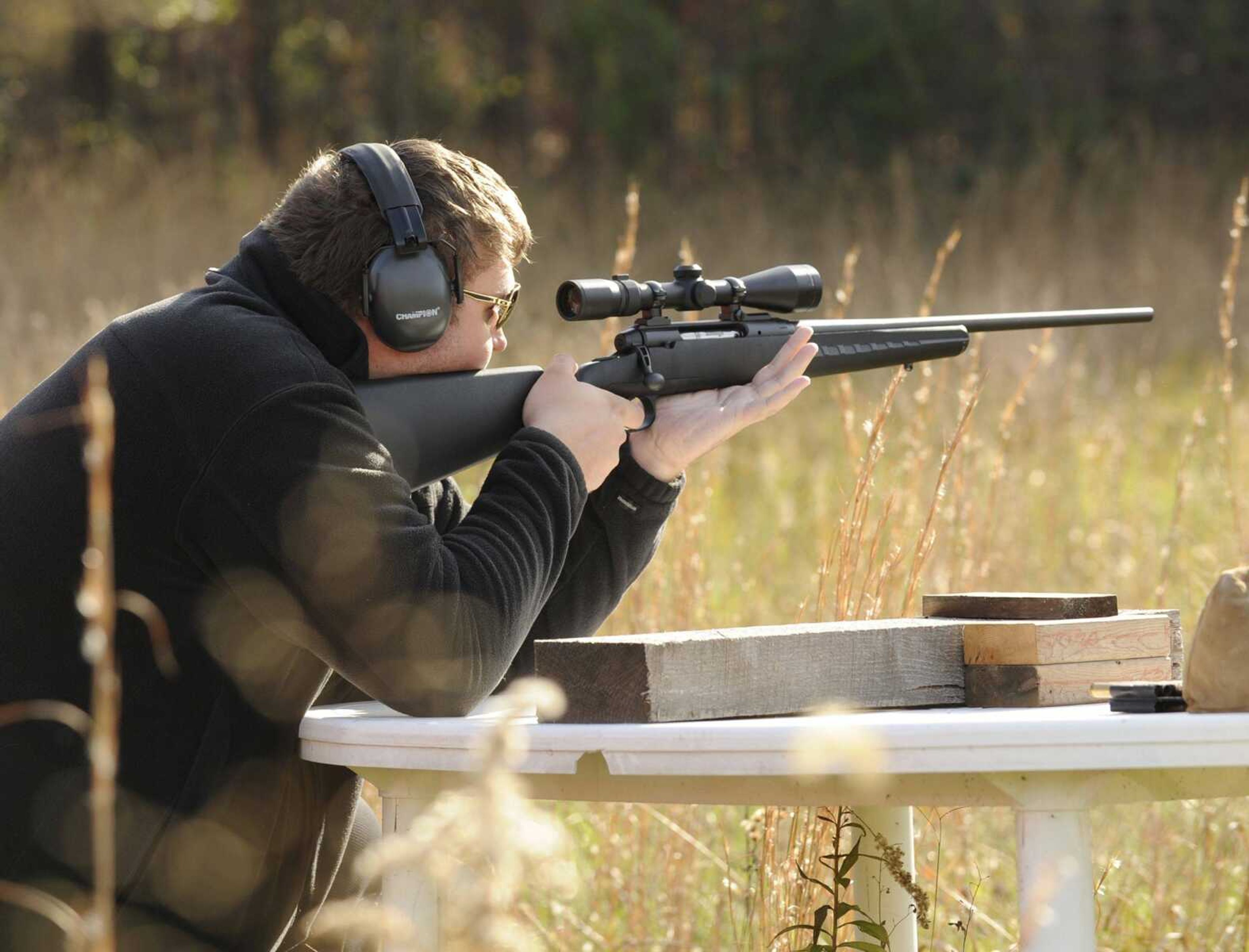 Seth Koehler sights in his rifle Saturday in preparation for deer season on land his family owns in Cape Girardeau County. (Glenn Landberg)