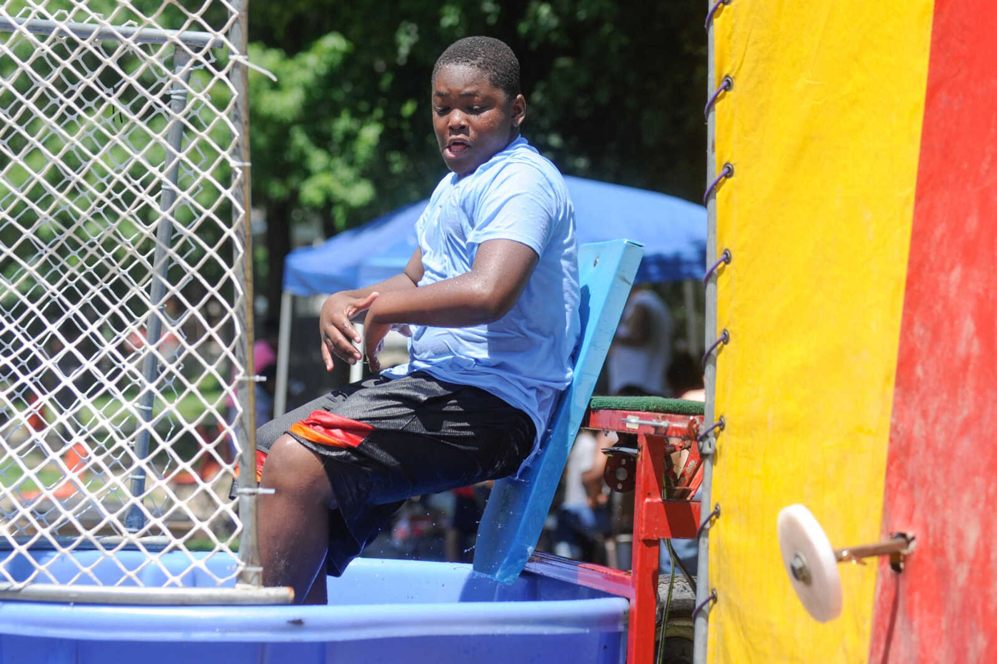 GLENN LANDBERG ~ glandberg@semissourian.com


Daniel Bird Jr. gets dunked by patrons during a block party in Cape Girardeau's ward 2 area, Saturday, June 20, 2015.