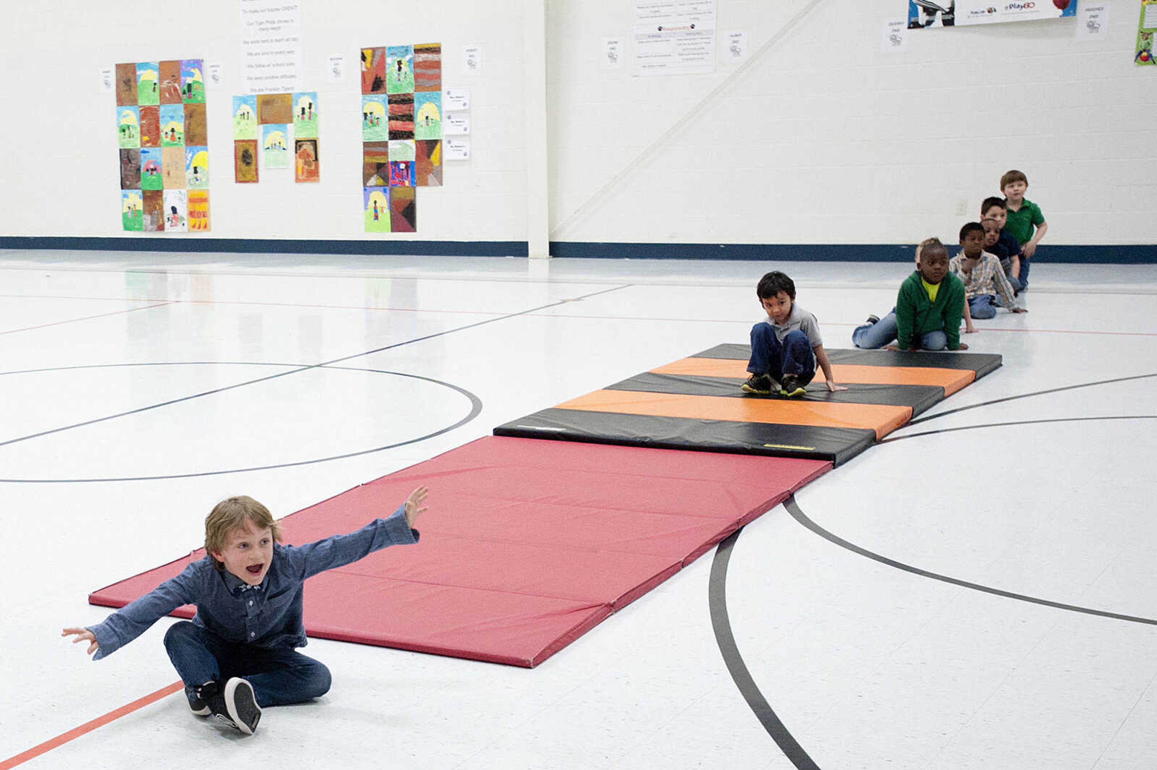 Gabriel Weimer, 6, reacts as his father, Command Chief Master Sgt. Geoff Weimer walks into the gym Friday, March 14, at Franklin Elementary School in Cape Girardeau. Sgt. Weimer is on leave from the Air Force after being deployed in the Middle East since Oct., and surprised his three sons, Geordan, 11, Eli, 9, and Gabriel, 6, in their respective classes.