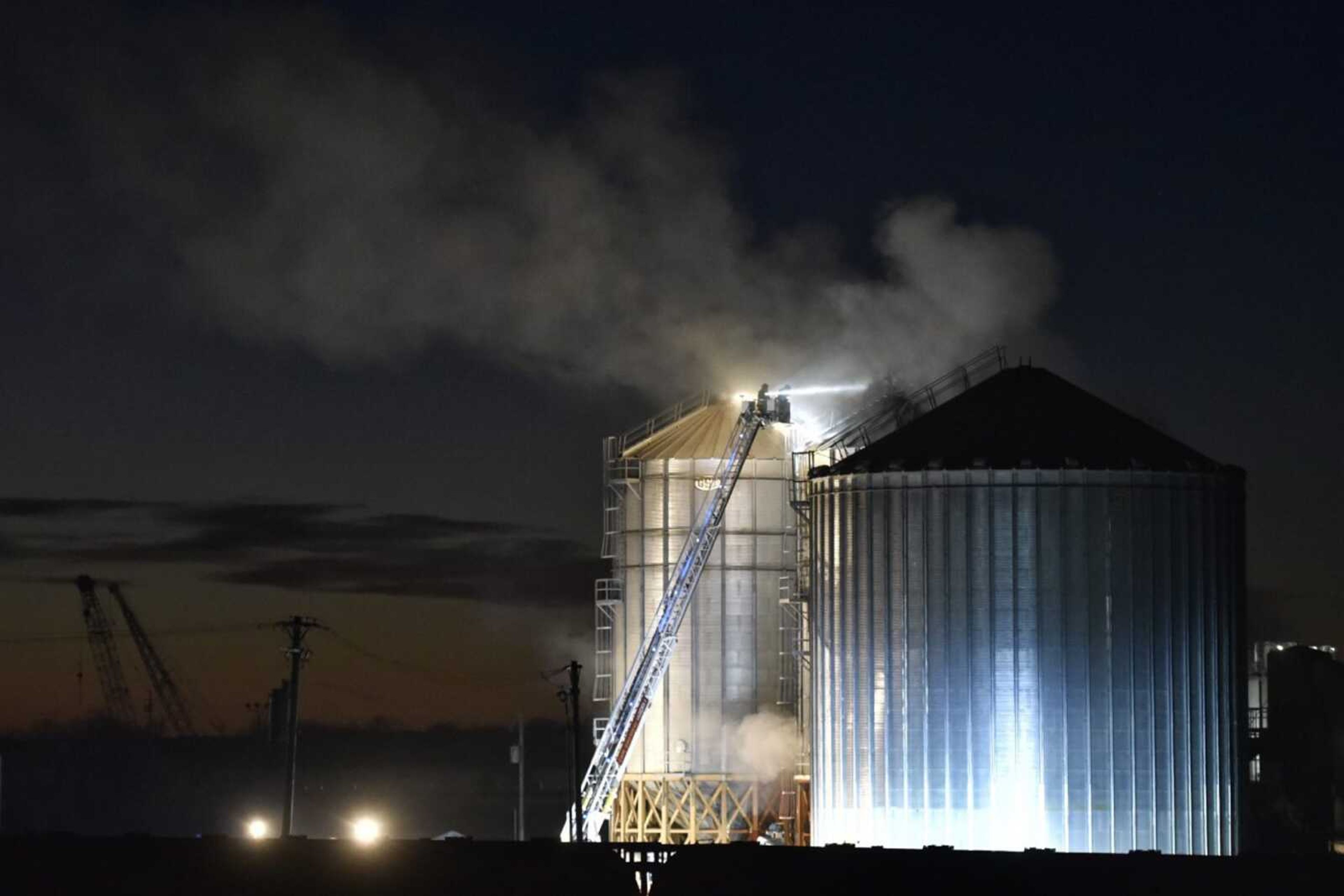 Local fire departments and emergency personnel respond to a fire in a grain silo at Midwest Grain and Barge, 179 Rushing Road in Scott City on Tuesday, Nov. 19. This is the second fire at the facility this month, the first occurring Nov. 6.