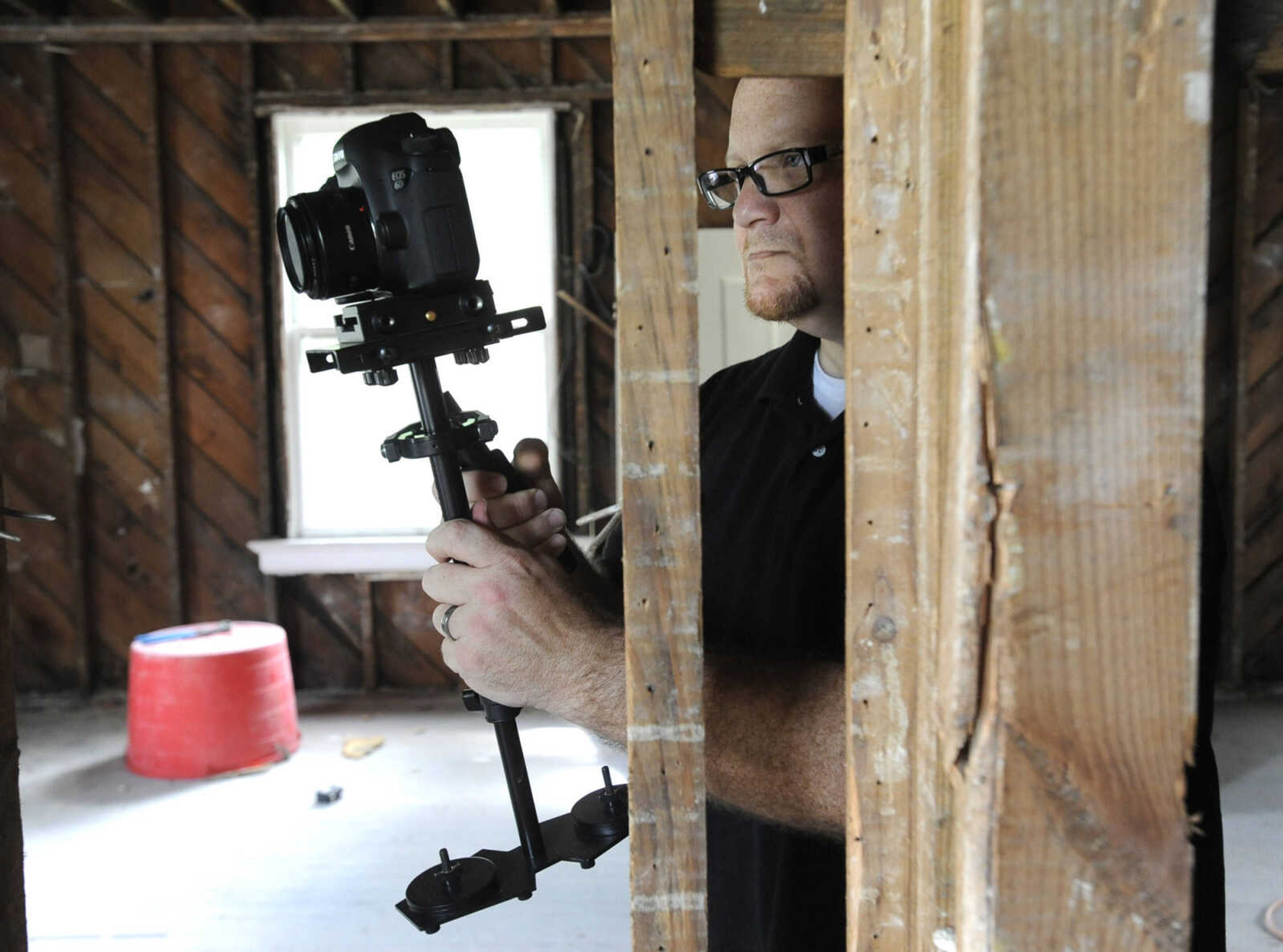 FRED LYNCH ~ flynch@semissourian.com
Rob Chronister records video of renovation work at the veterans transition house Saturday, Sept. 10, 2016 as part of the United Way Days of Caring in Cape Girardeau.