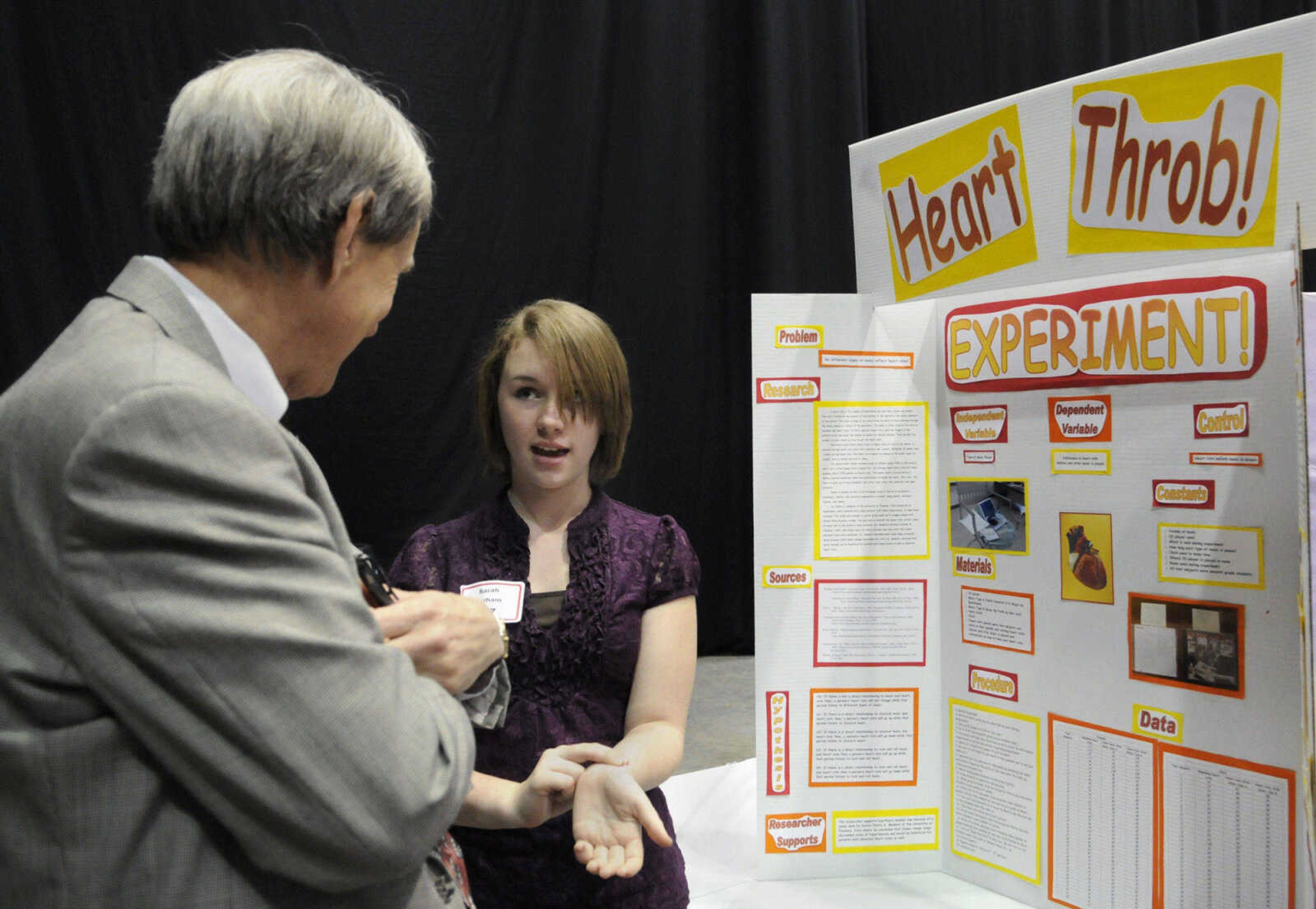 KRISTIN EBERTS ~ keberts@semissourian.com

Dexter eighth-grader Sarah Durham, 14, describes her project, which studied the effects of different types of music on heart rates, to judge and Fair co-director Chris McGowan, during the 54th Annual Southeast Missouri Regional Science Fair at the Show Me Center on Tuesday, March 9, 2010.