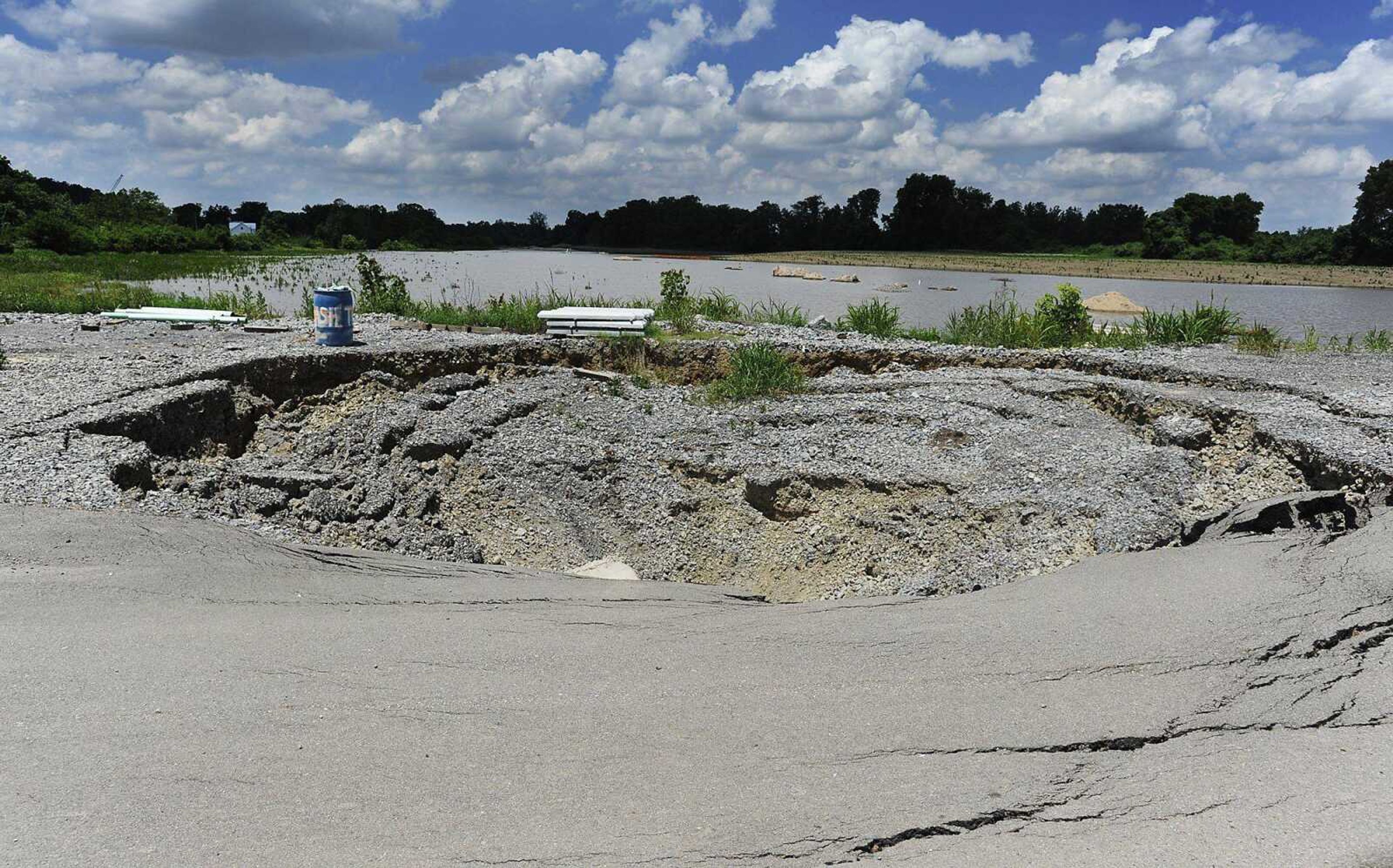 ADAM VOGLER ~ avogler@semissourian.comOne of two sinkholes located in the 2300 block of South Sprigg StreetFriday, June 7, in Cape Girardeau. The sinkholes, which have caused the street to be closed, are getting worse according to Cape Girardeau public service director Tim Gamling.