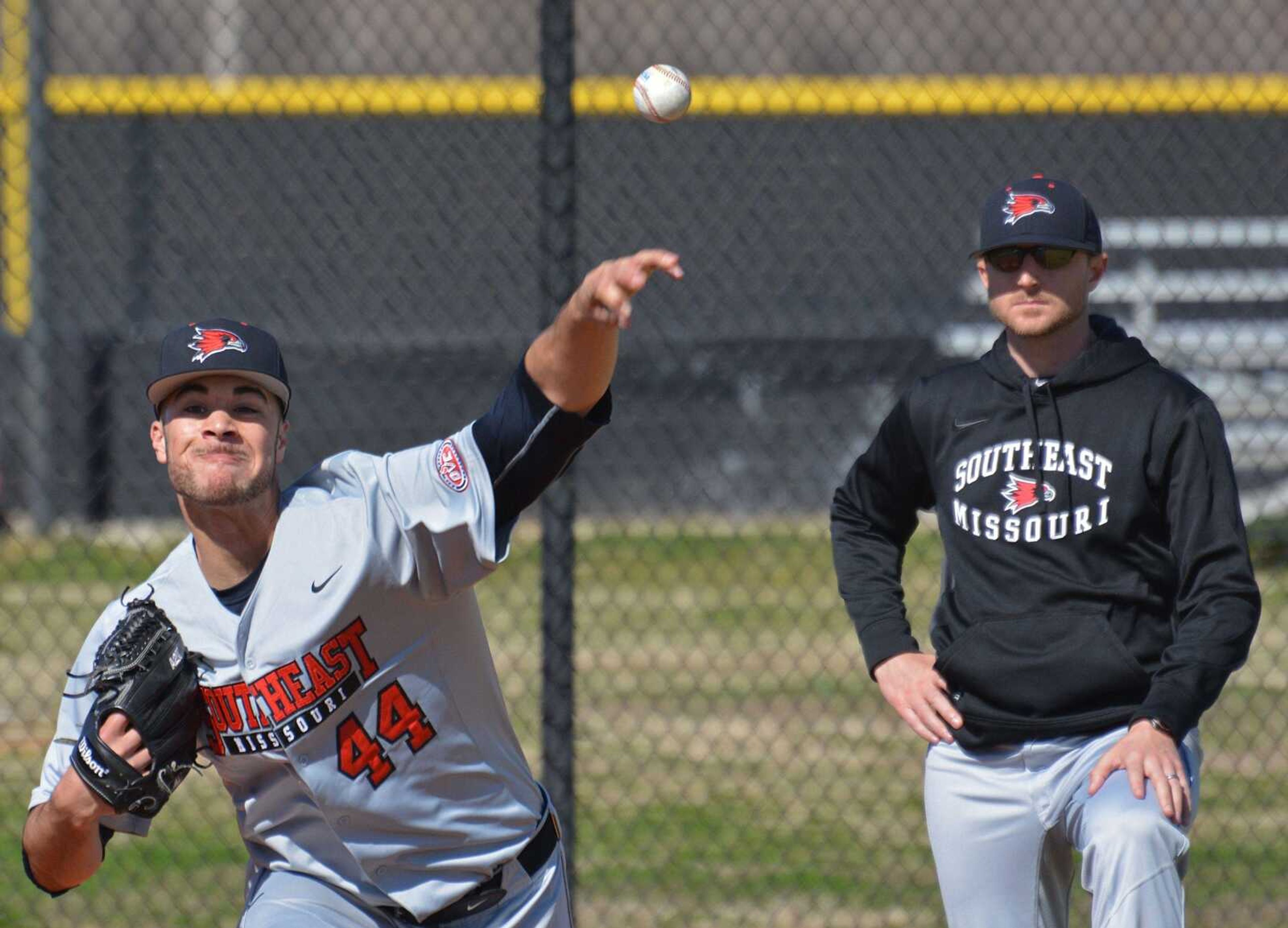 Former Southeast Missouri State pitching coach Lance Rhodes watches two-time OVC Pitcher of the year Joey Lucchesi warm up before a game this past season. Rhodes will serve as former Redhawks coach Stever Bieser's recruiting coordinator at Missouri.