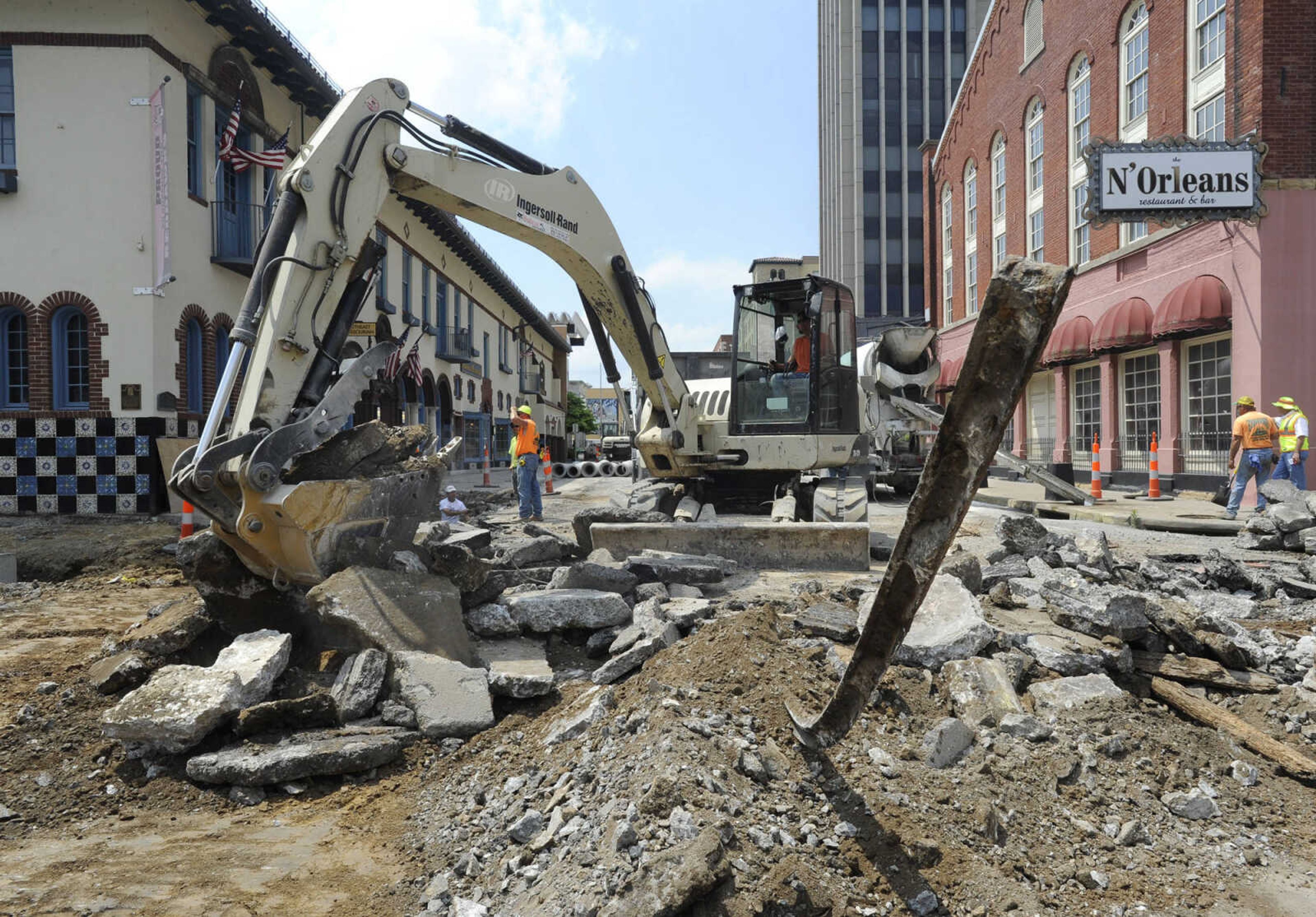 FRED LYNCH ~ flynch@semissourian.com
An old trolley rail awaits removal from the intersection of Broadway and Lorimier Street by a Fronabarger Concreters crew Friday, May 4, 2012. The crew is working west on the Broadway corridor project.