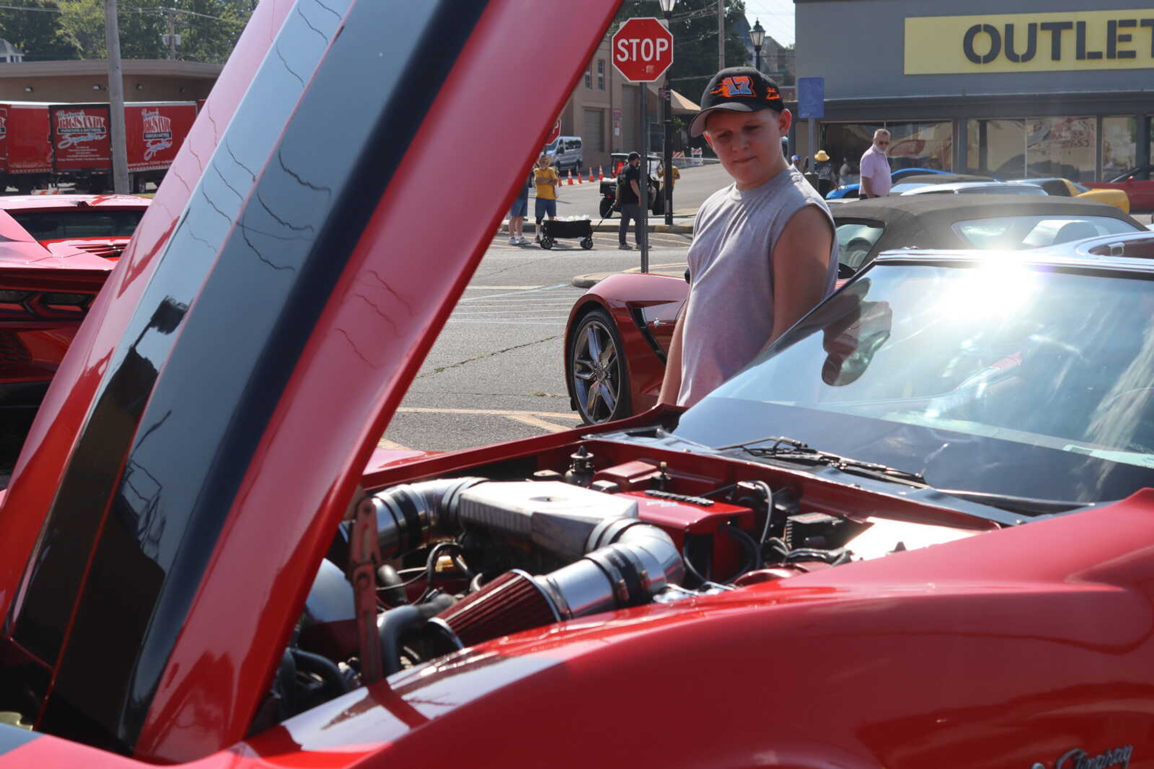 Micheal Ensey looks at his uncle Brandon's Corvette.