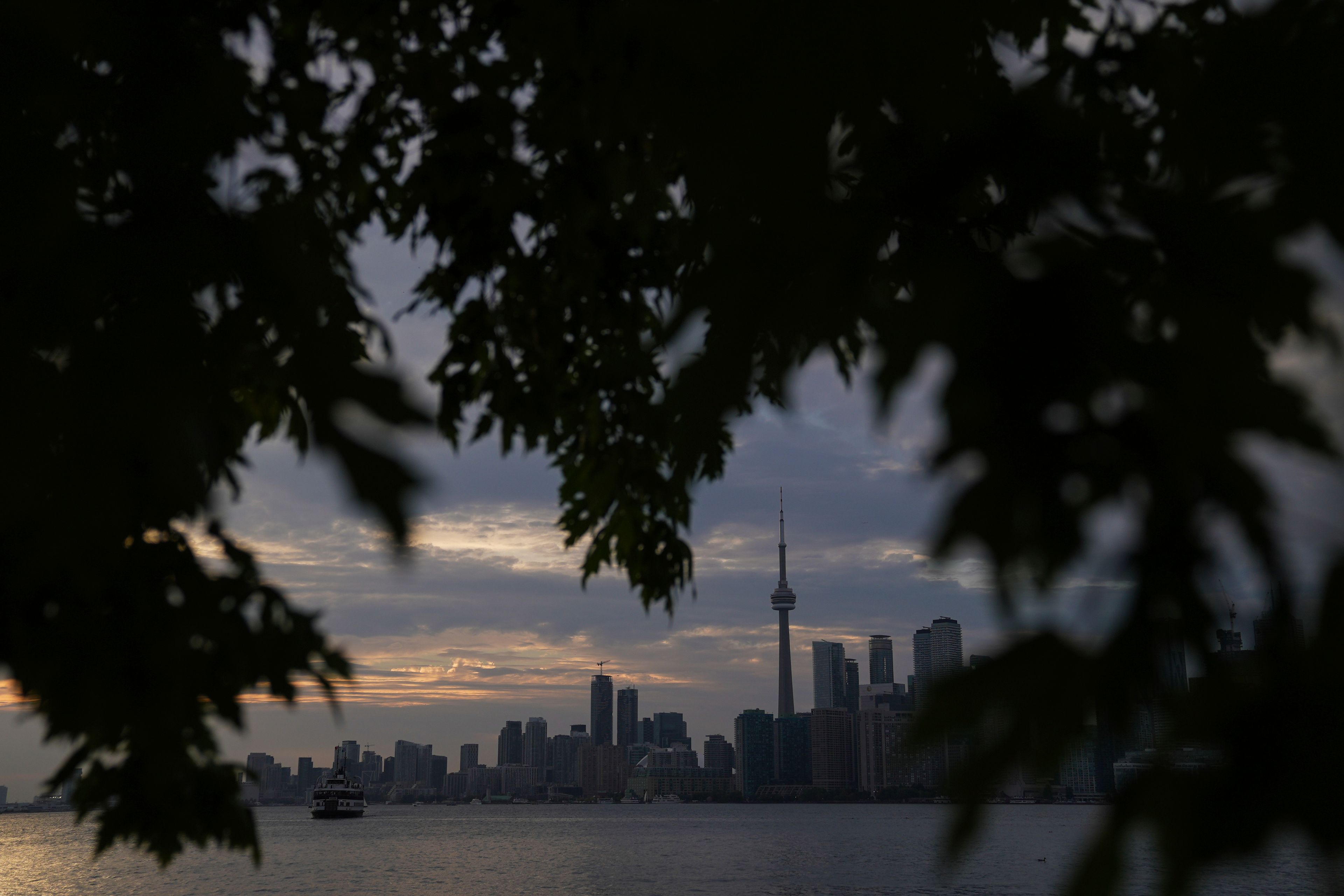 The Toronto skyline is seen from Wards Island in Toronto on Thursday, Sept. 19, 2024. (AP Photo/Angie Wang)