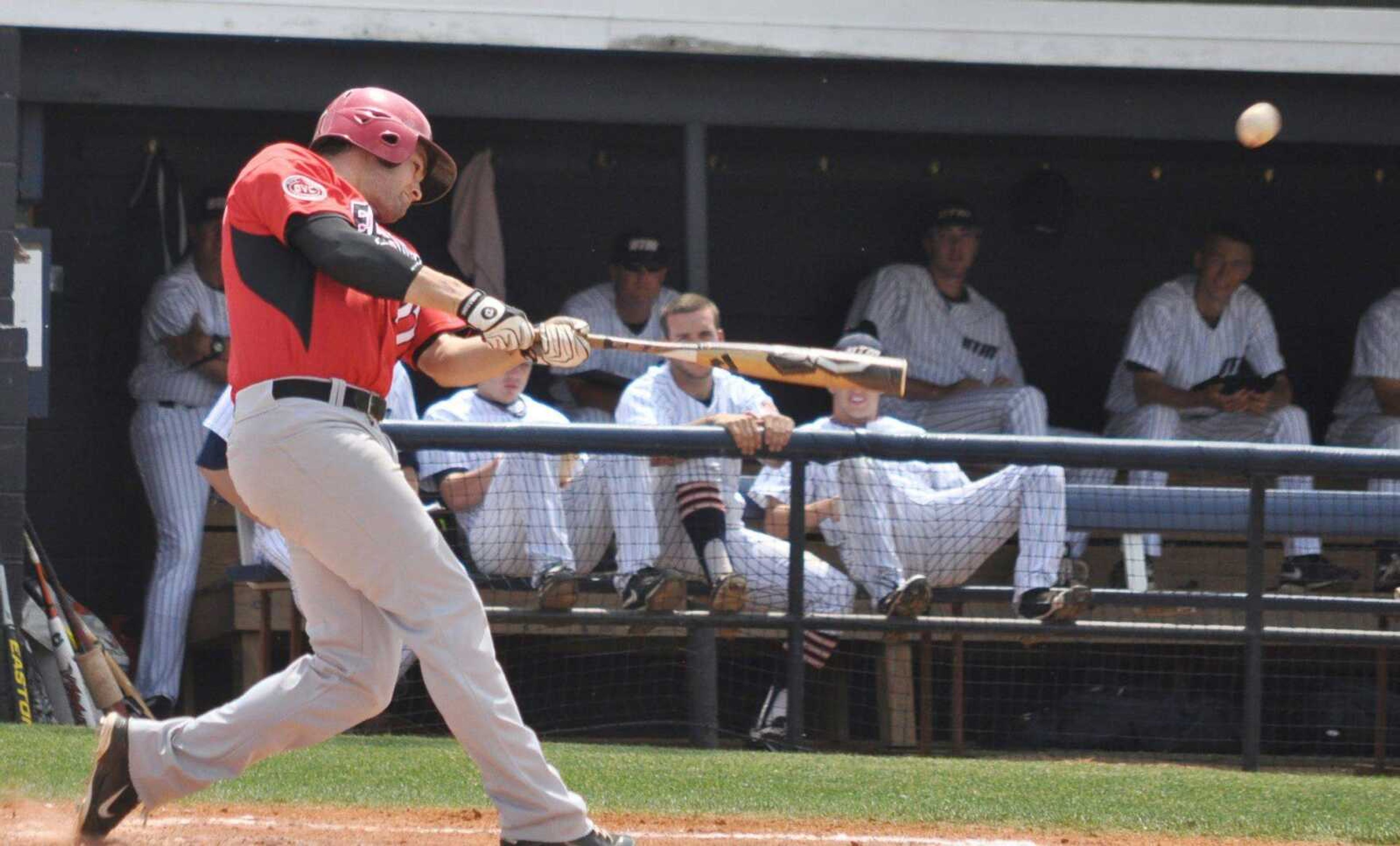 Southeast Missouri State outfielder Derek Gibson blasts a three-run home run against Tennessee-Martin during the fourth inning Sunday in Martin, Tenn. Gibson had two home runs and seven RBIs in the Redhawks&#8217; 14-2 victory. Gibson also has a 29-game hitting streak. (WAYNE MCPHERSON ~ Special to the Southeast Missourian)