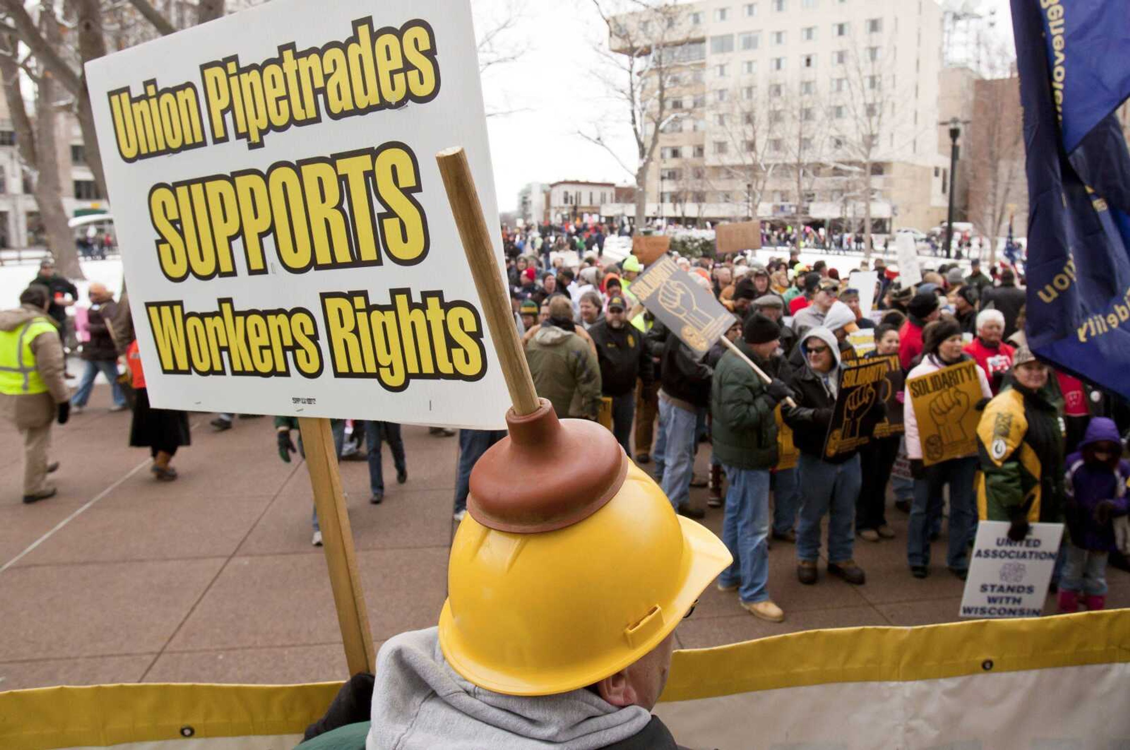 Union plumber Mike Diebold of Cross Plains, Wis., demonstrates out in front of the state Capitol in Madison, Wis., Saturday, March 5, 2011. Opponents to the governor's bill to eliminate collective bargaining rights for many state workers are on their 18th day of demonstrations at the Capitol. (AP Photo/Andy Manis)