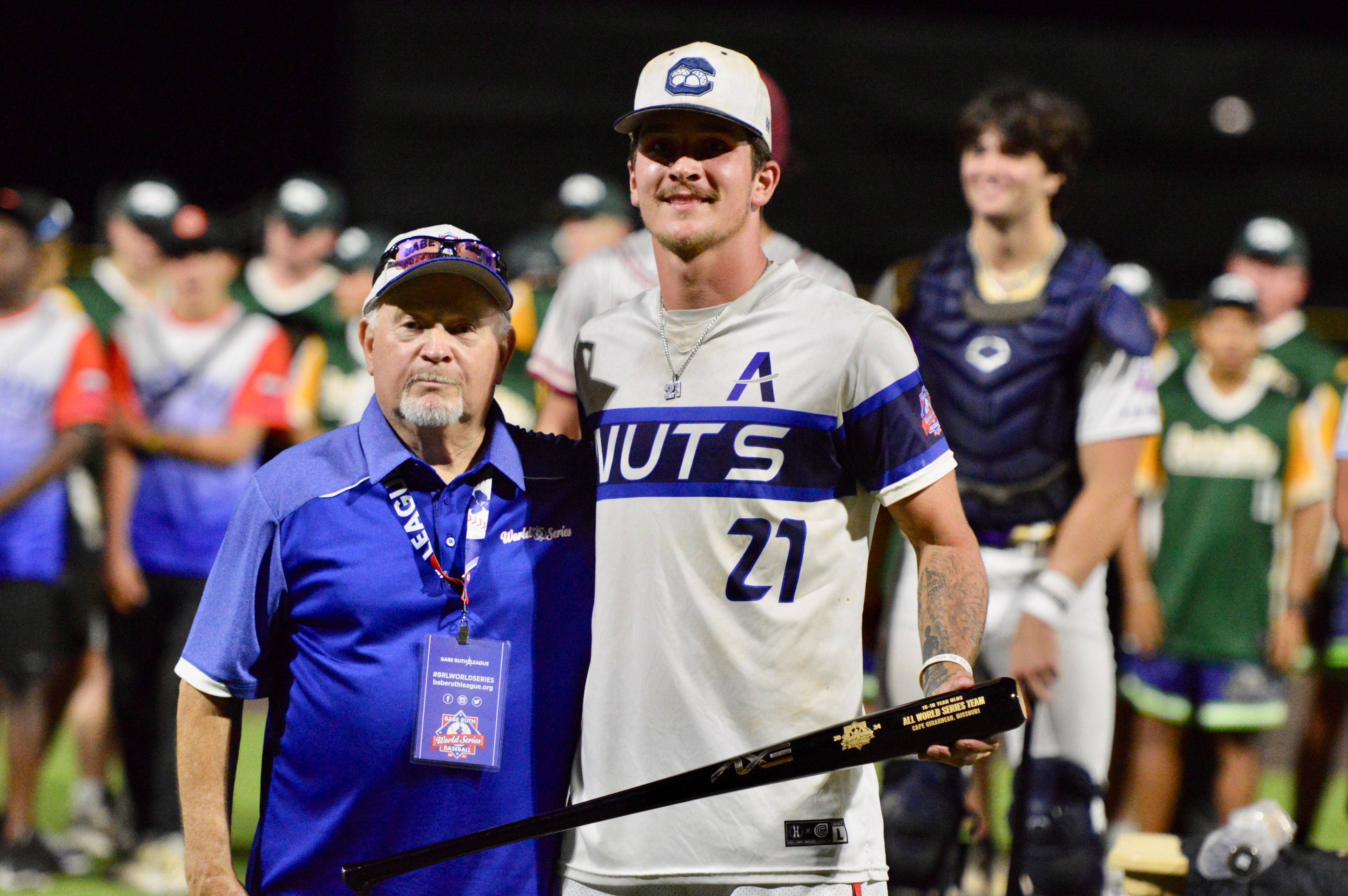 Charleston Fighting Squirrels’ Levi McKinnie is handed an All-World Series team trophy at the Babe Ruth World Series on Thursday, Aug. 15, at Capaha Field in Cape Girardeau, Mo. 