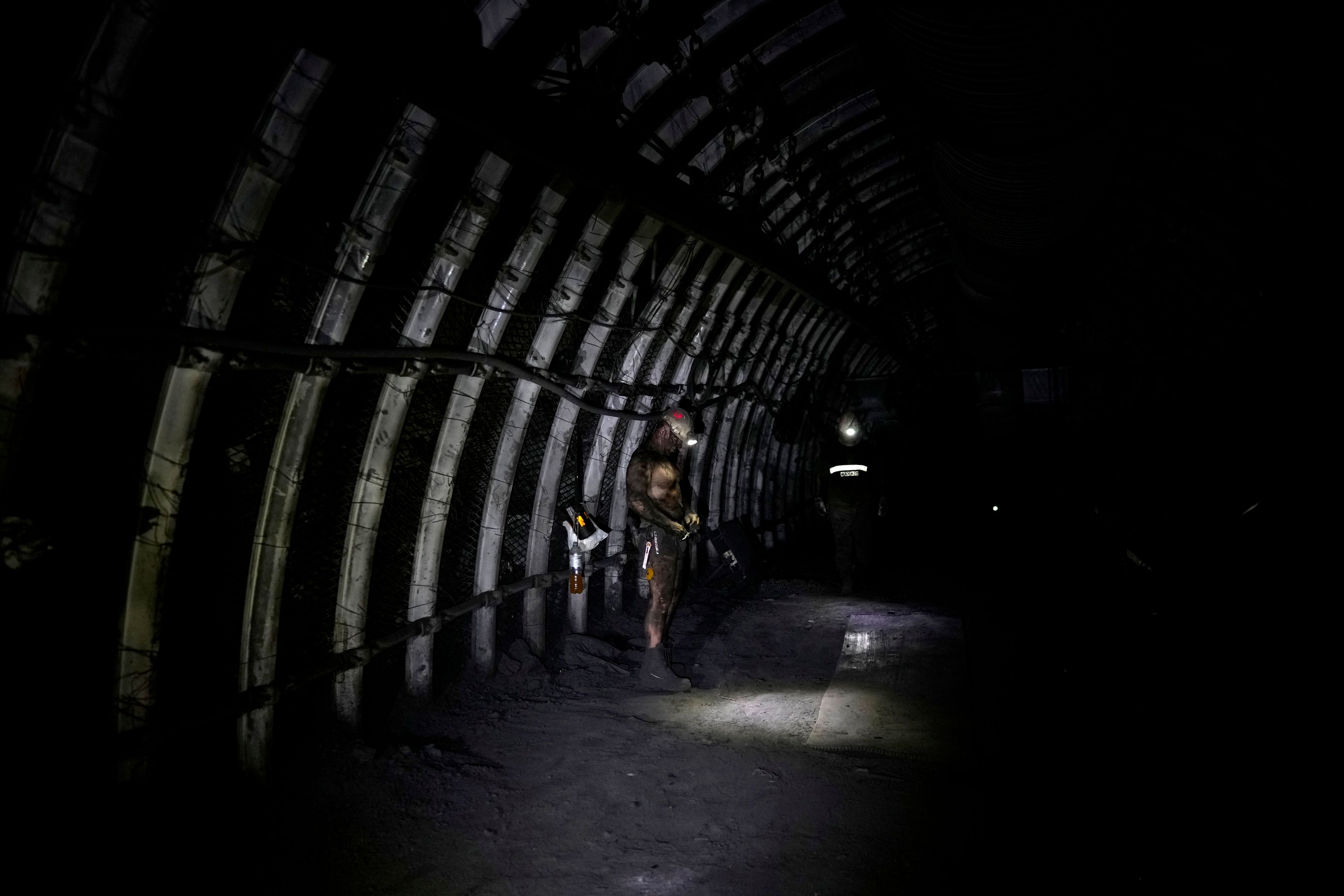 FILE - A miner stands in a shaft of the CSM coal mine in Stonava, Czech Republic, Monday, Oct. 14, 2024. (AP Photo/Petr David Josek, File)