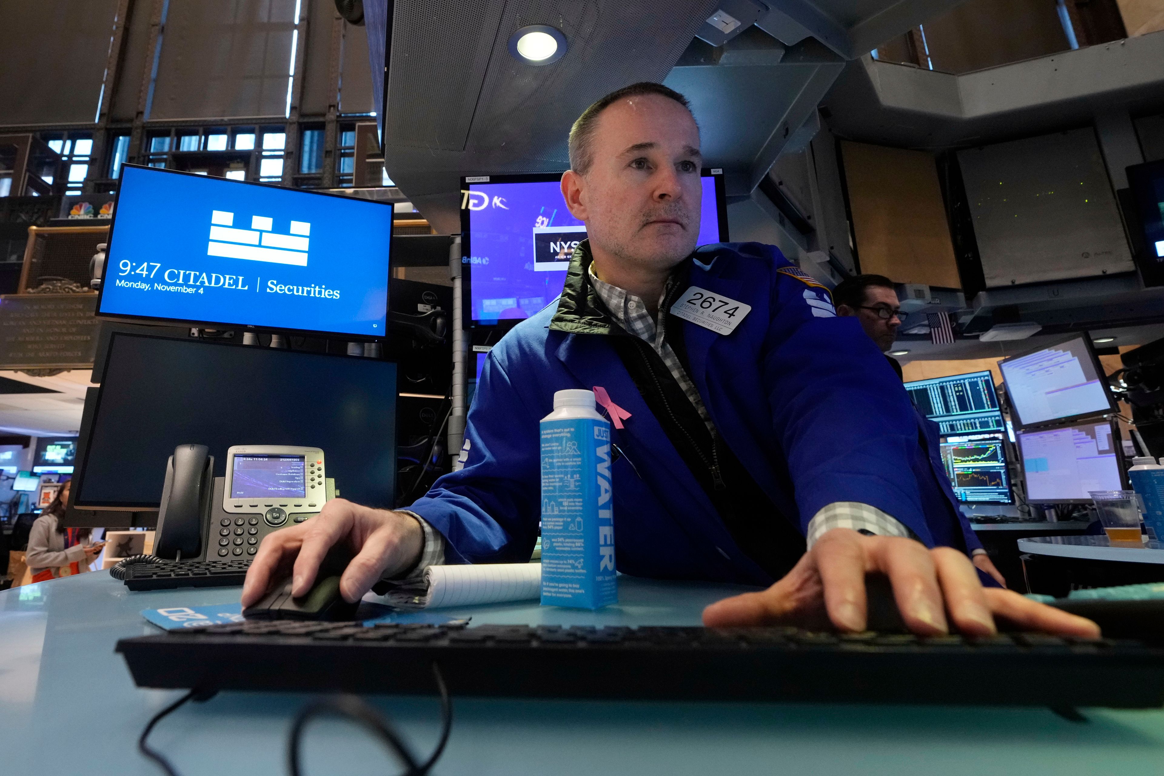 Specialist Stephen Naughton work at his post on the floor of the New York Stock Exchange, Monday, Nov. 4, 2024. (AP Photo/Richard Drew)