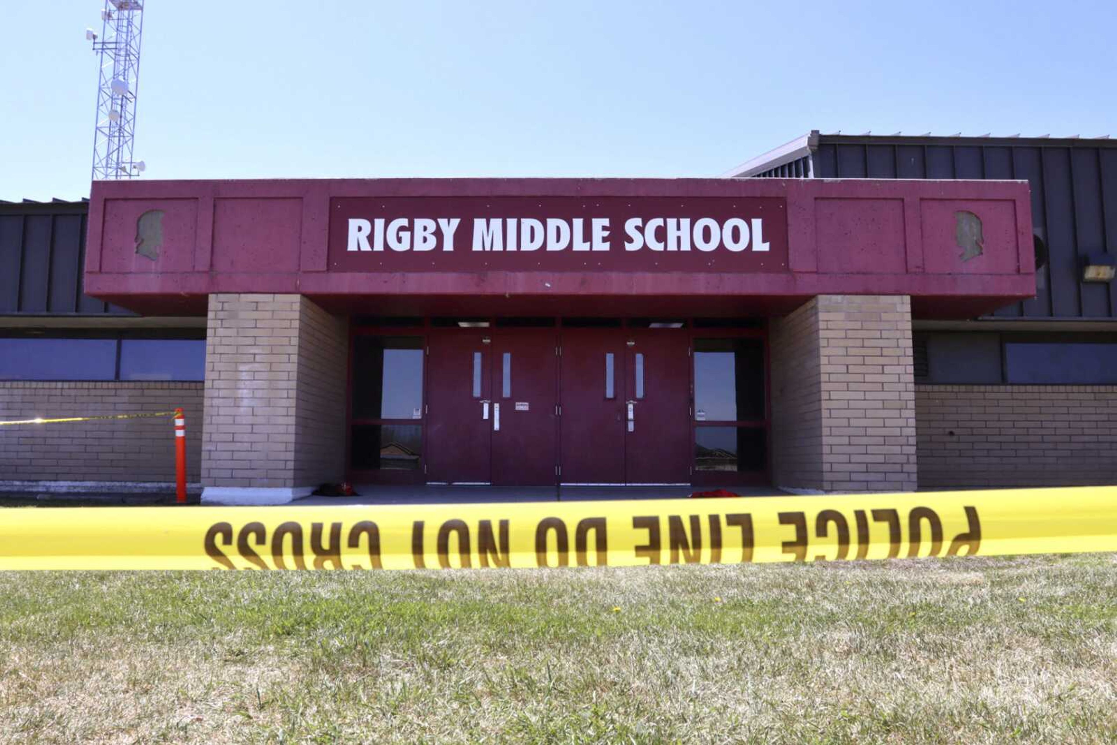 Police tape marks a line outside Rigby Middle School following a shooting there earlier Thursday in Rigby, Idaho.