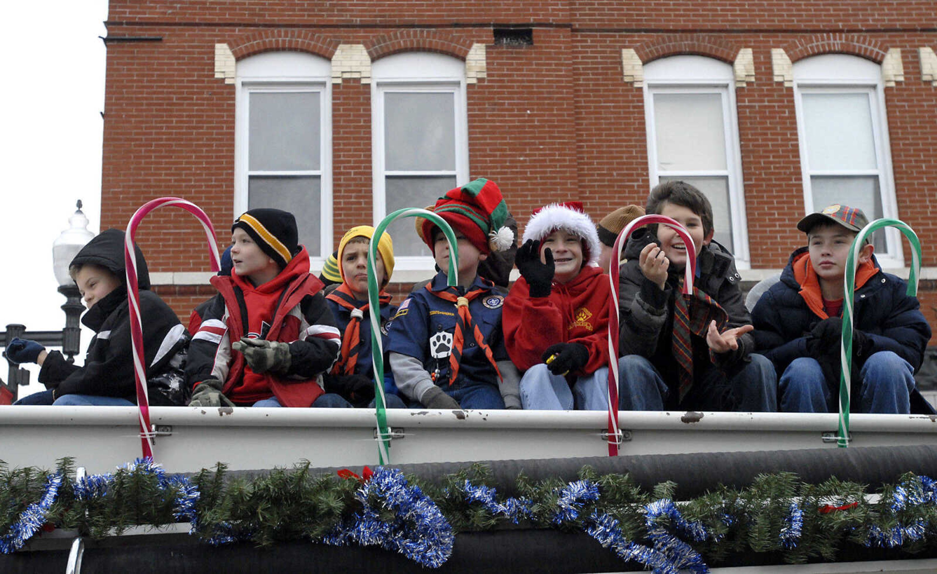 KRISTIN EBERTS ~ keberts@semissourian.com

Cub Scouts ride on a Millersville fire truck during the Jackson Christmas Parade on Saturday, Dec. 4, 2010, in downtown Jackson.