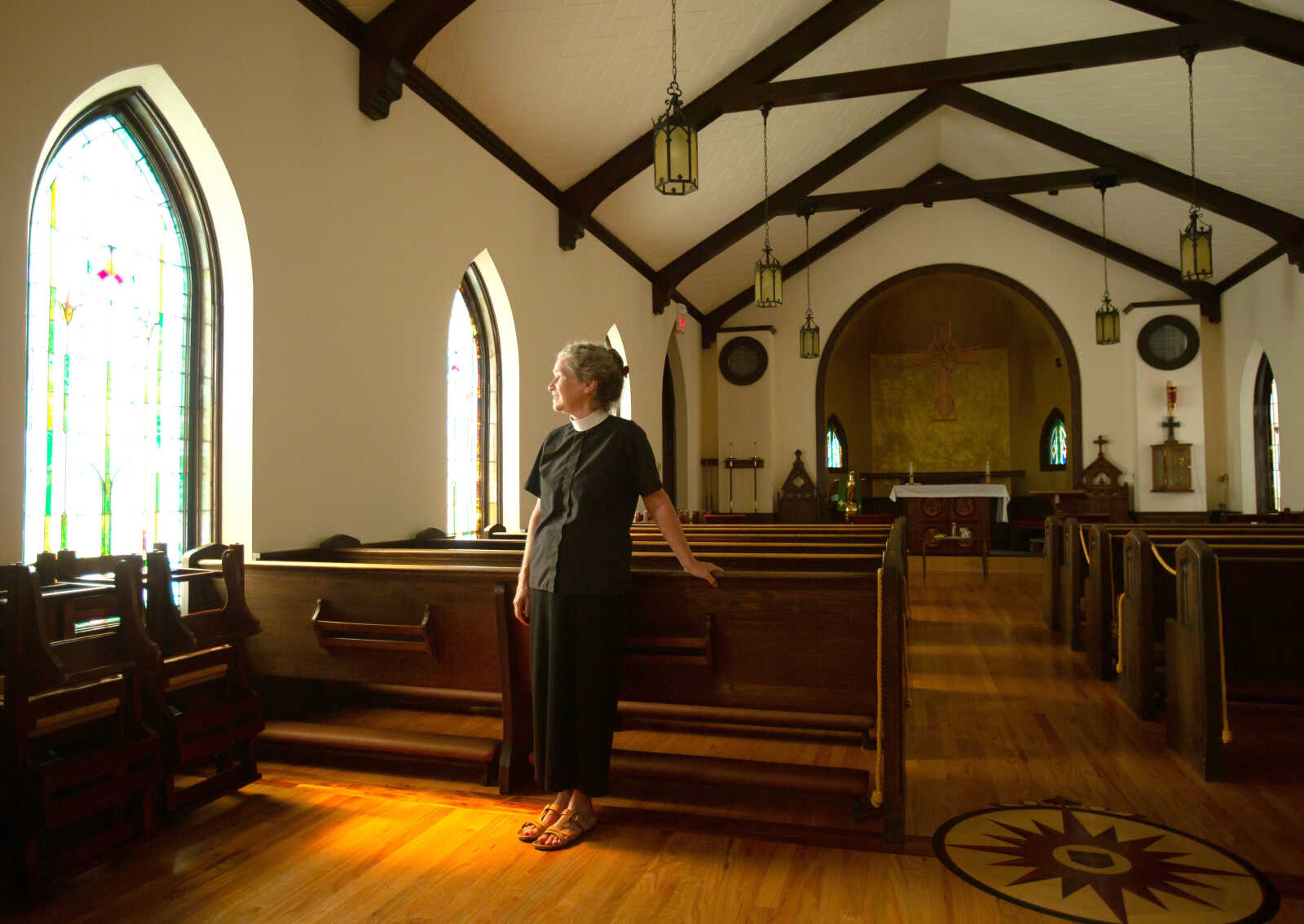 Rev. Edie Bird stands for a photo in the sanctuary of Christ Episcopal Church in Cape Girardeau on Thursday, July 2. Bird will be retiring after 31 years as an Episcopal priest.