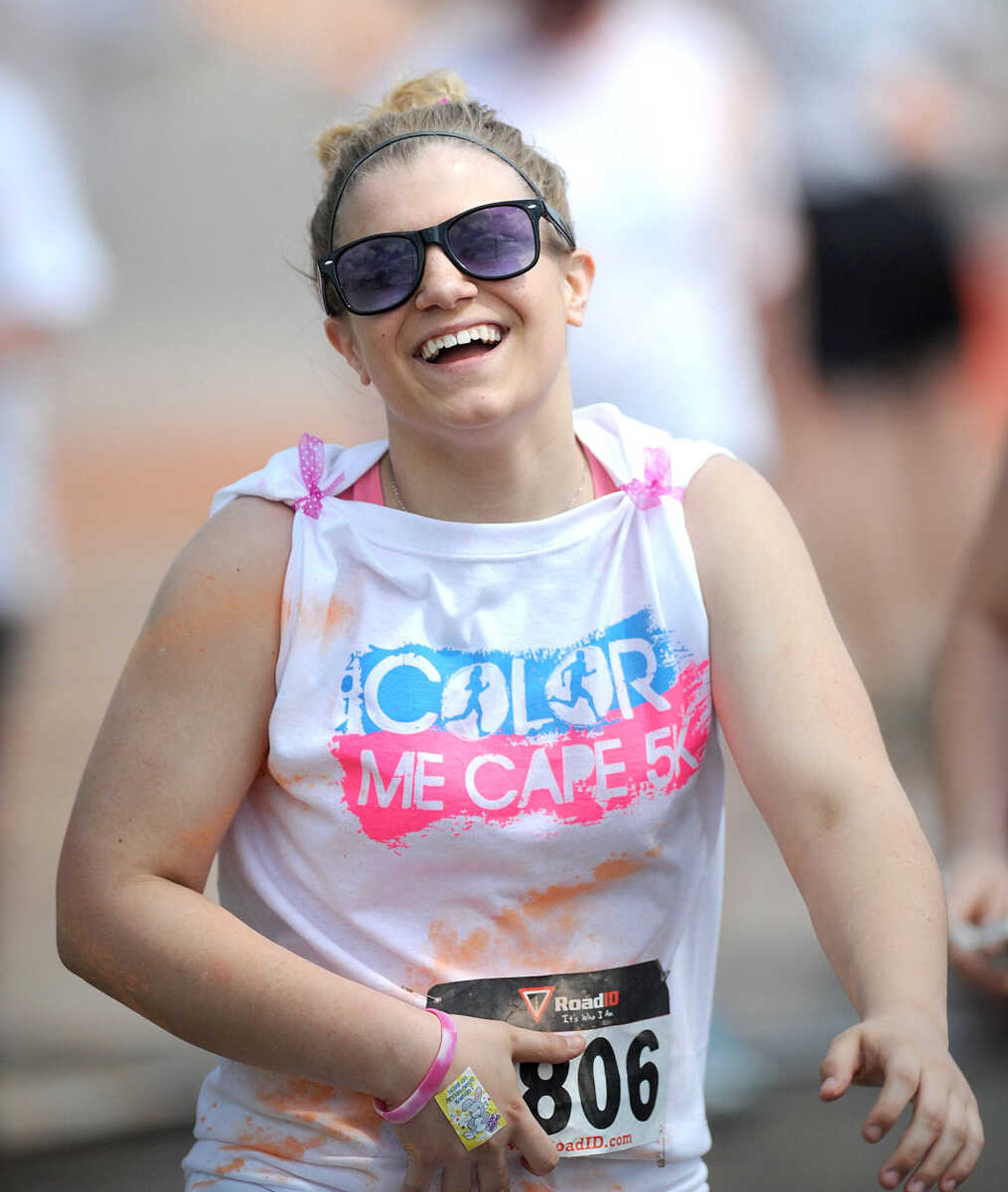 LAURA SIMON ~ lsimon@semissourian.com

Participants in the Color Me Cape 5K are sprayed with orange powder at the first color station on Good Hope Street, Saturday, April 12, 2014, in Cape Girardeau.