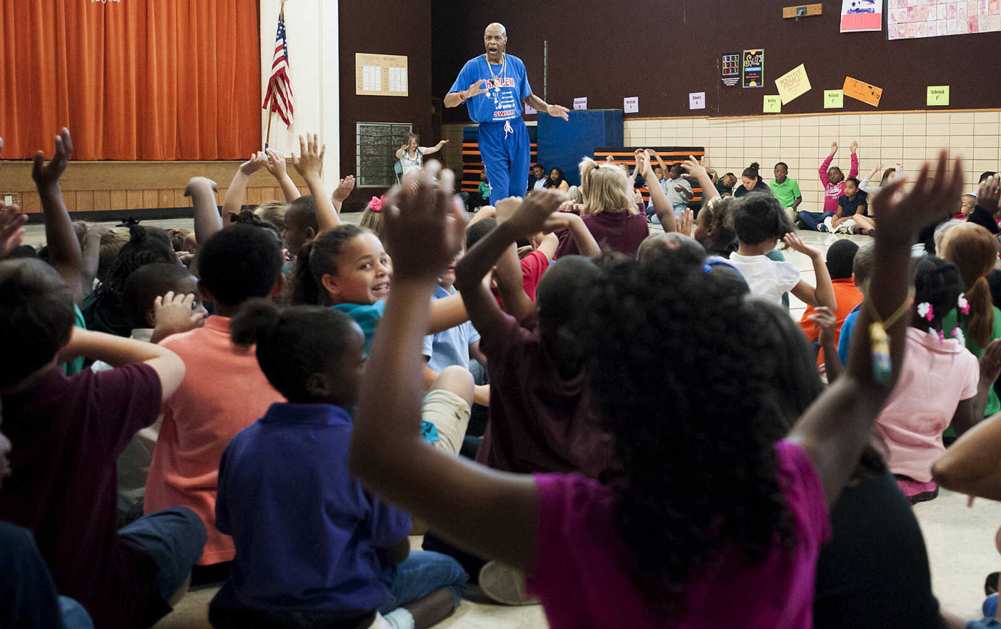 Captain "Magic" Valentino Willis talks with the students at Jefferson Elementary School Tuesday, Sept. 24, in Cape Girardeau. Willis, who is with the Harlem Swish Comedic Basketball Team, used his basketball and comedy skills to encourage the students to not smoke, drink or do drugs while respecting their teachers, principals, coaches and each other.