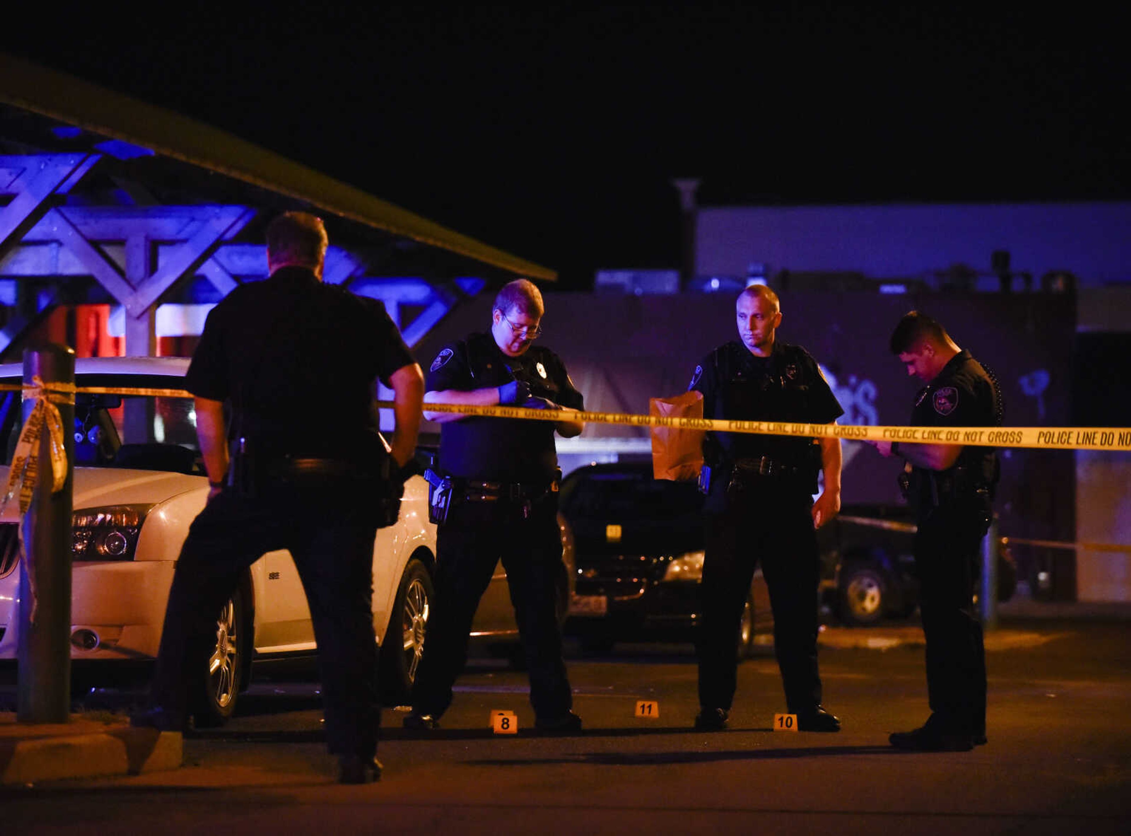 Officers with the Cape Girardeau Police Department investigate the scene of a shooting early Sunday, June 2, 2018 at the intersection of Independence and Main Street in Cape Girardeau.