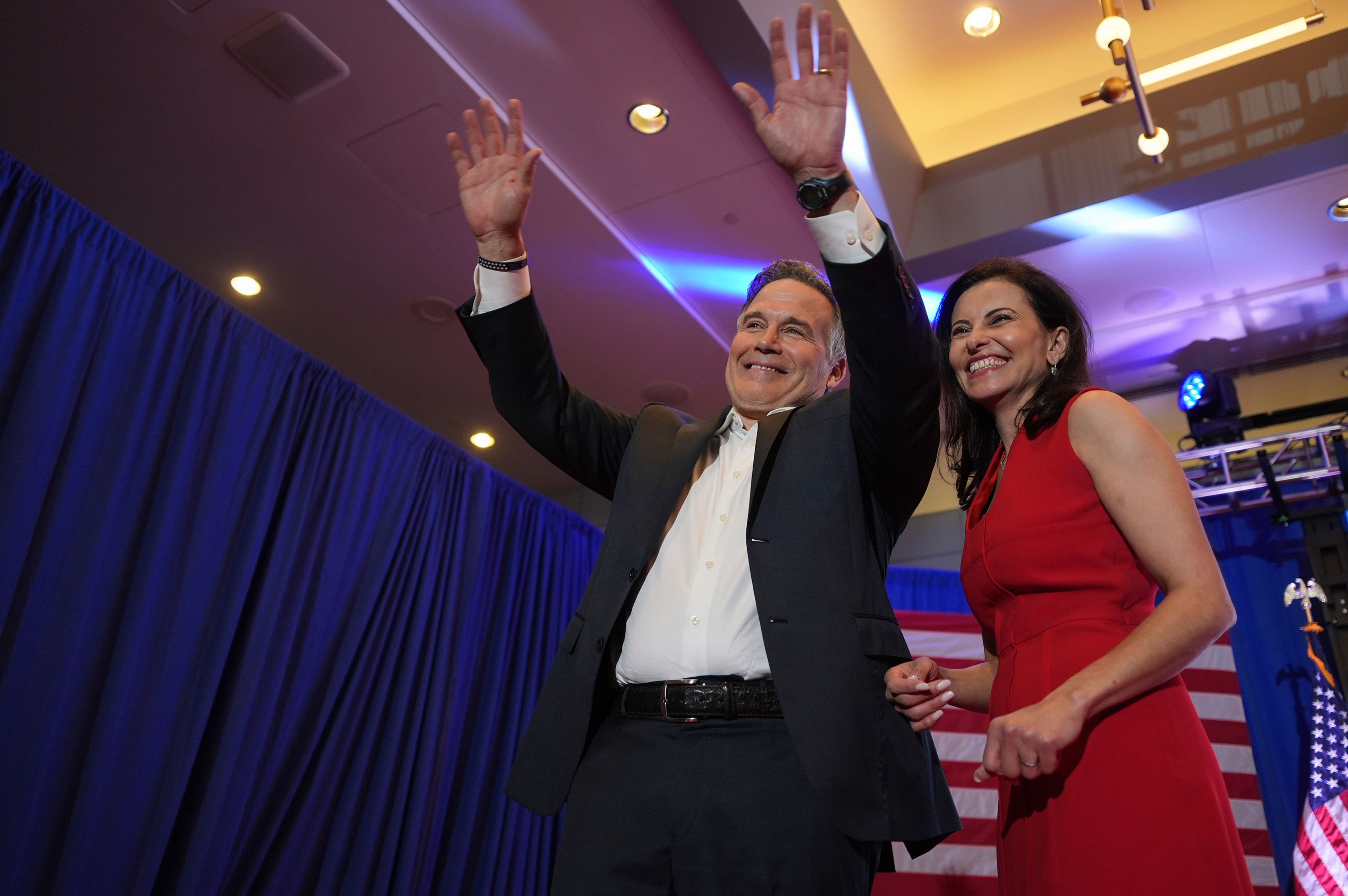 Republican Pennsylvania Senate candidate David McCormick, left, waves to the crowd while on stage with his wife, Dina Powell, during an election night watch party, Wednesday, Nov. 6, 2024, in Pittsburgh. (AP Photo/Gene J. Puskar)